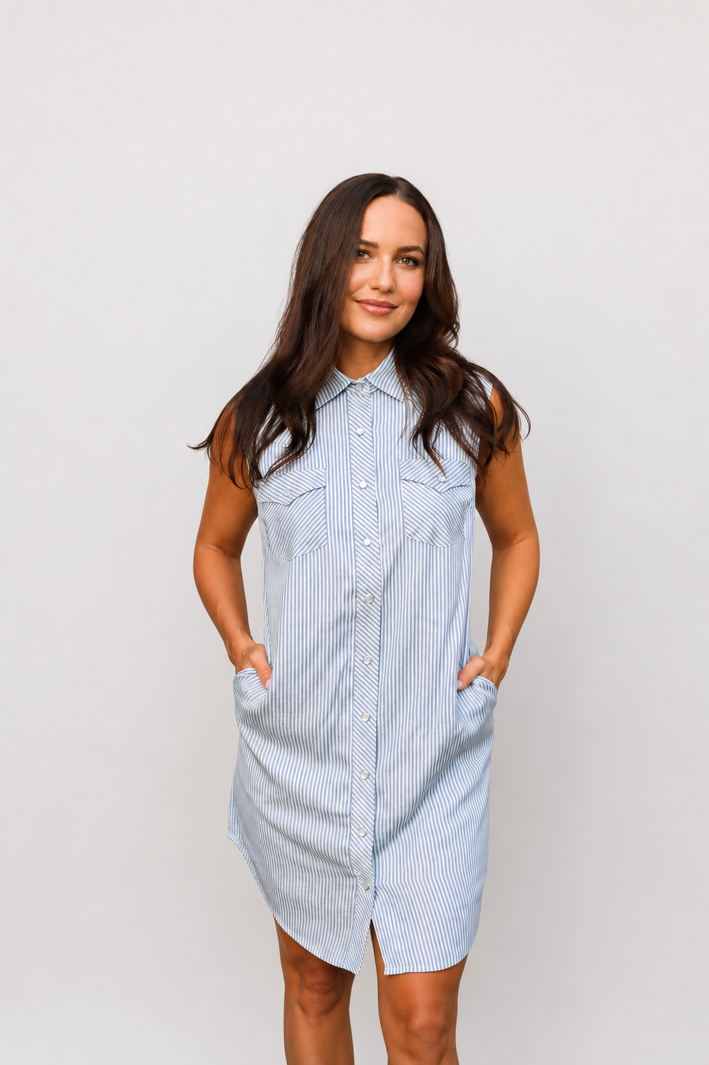 Front view of the H Bar C Palm Beach grey striped sleeveless western dress with hands in pockets.