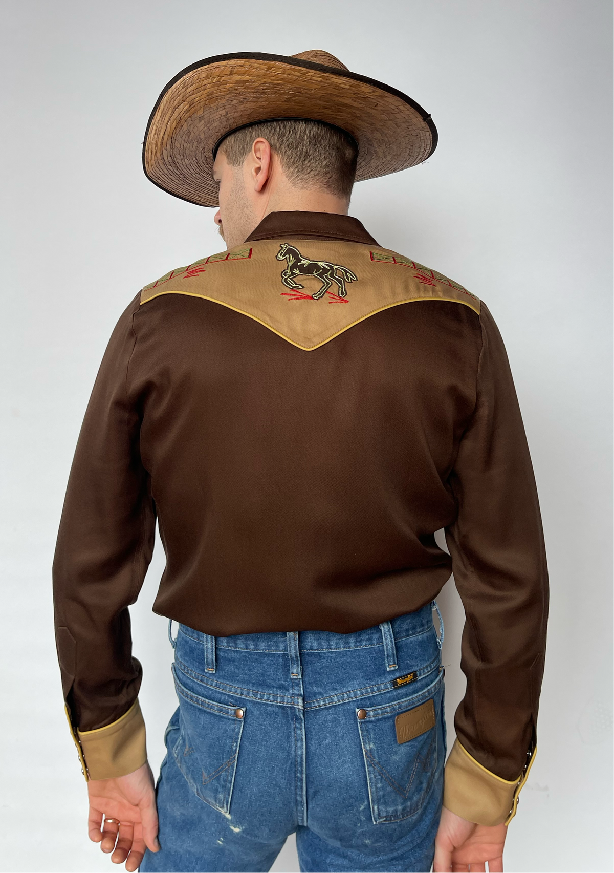 Back of the H Bar C Bozeman shirt with tan embroidered back yoke and contrast cuffs.