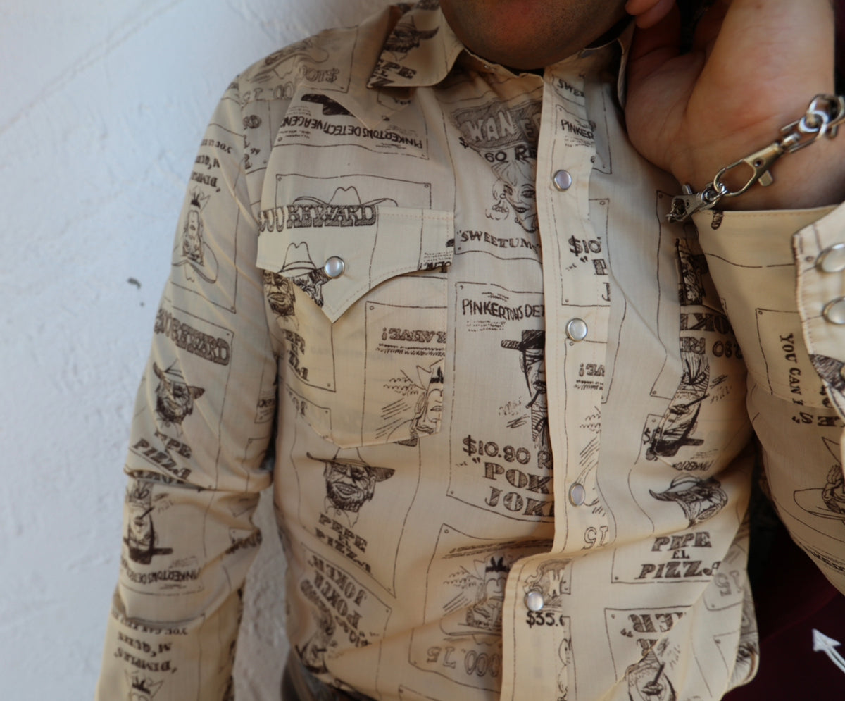 Close-up of the vintage cowboy print on the H Bar C Tumbleweed beige snap shirt.