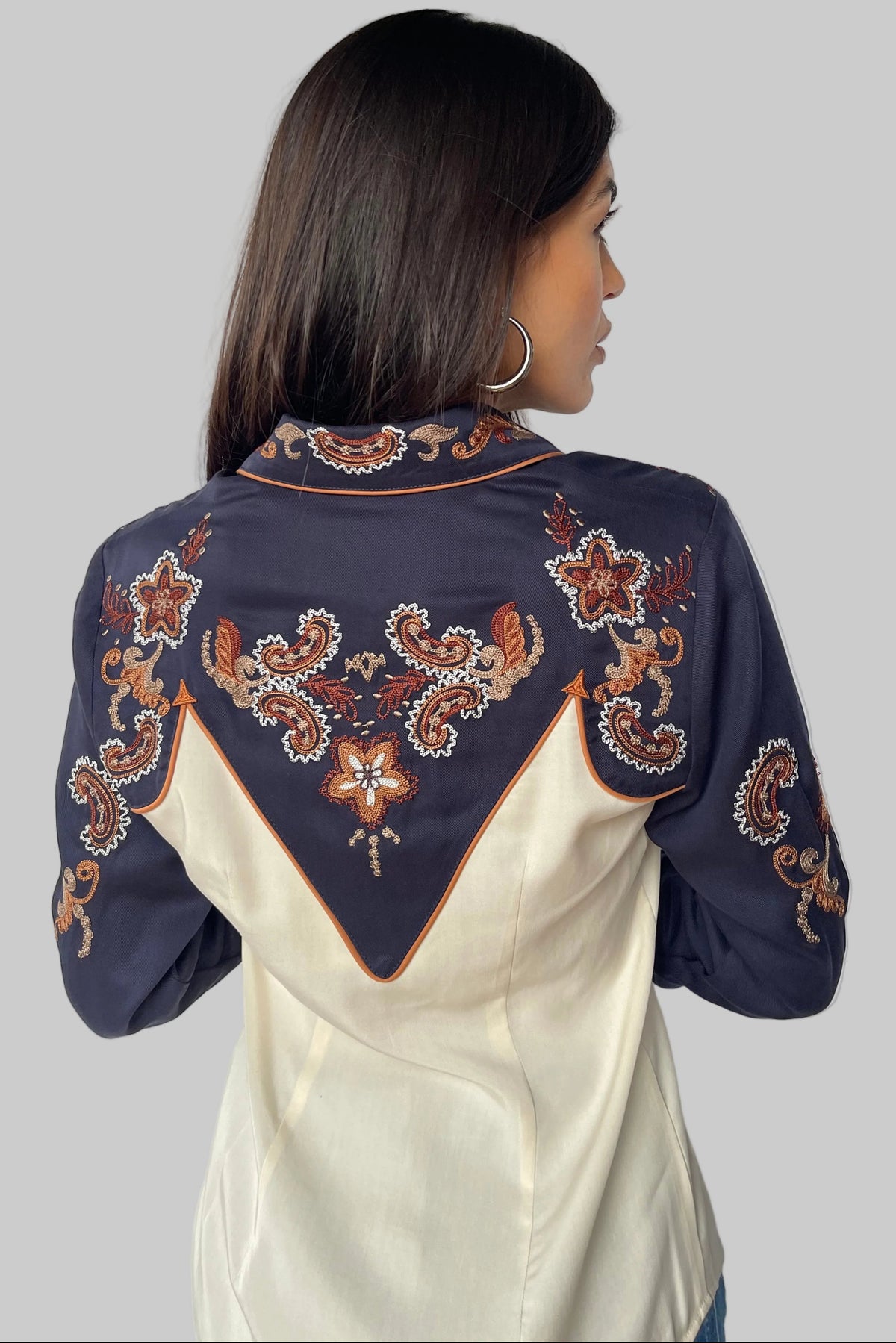 Back view of the H Bar C Aspen women's western shirt with navy yoke, off white panel, and floral chain stitch embroidery.
