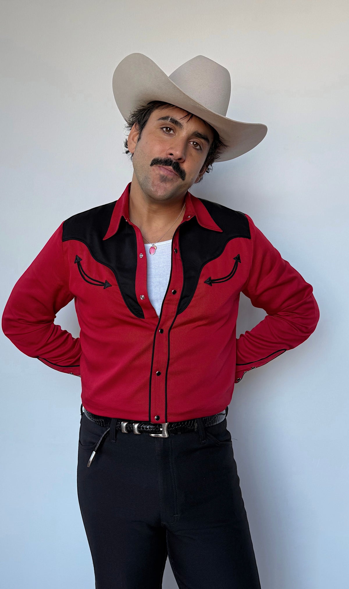 Front view of the H Bar C San Juan men's red shirt with black yoke, smile pockets, and pearl snaps.