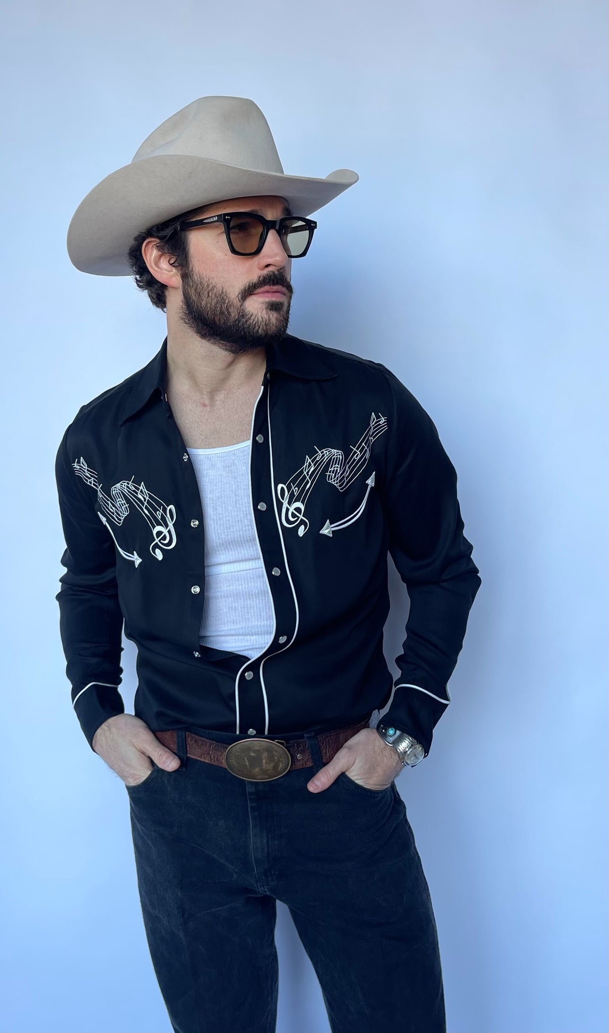 Front view of the H Bar C Nashville shirt with white embroidered yokes over a white tank.