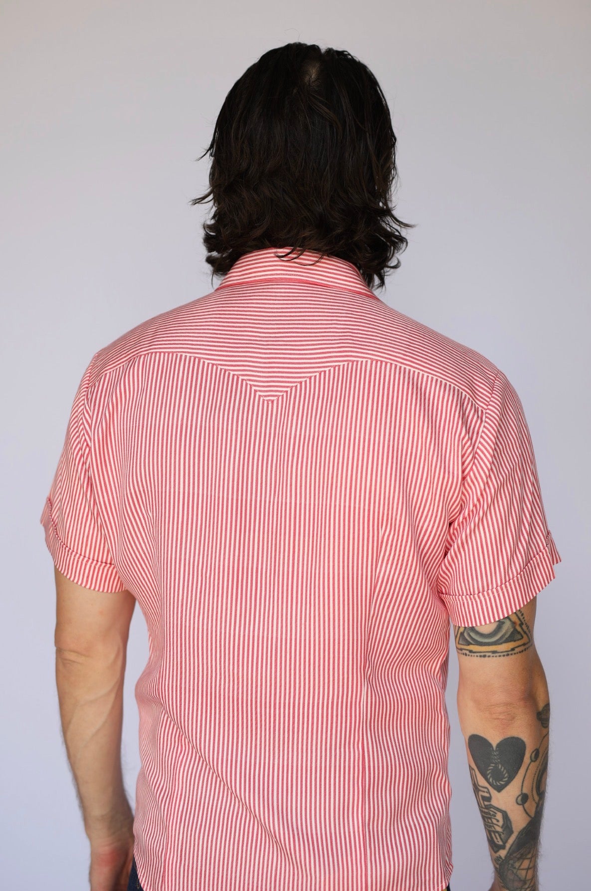 Rear view of the H Bar C Newport red stripe western shirt with back yoke.