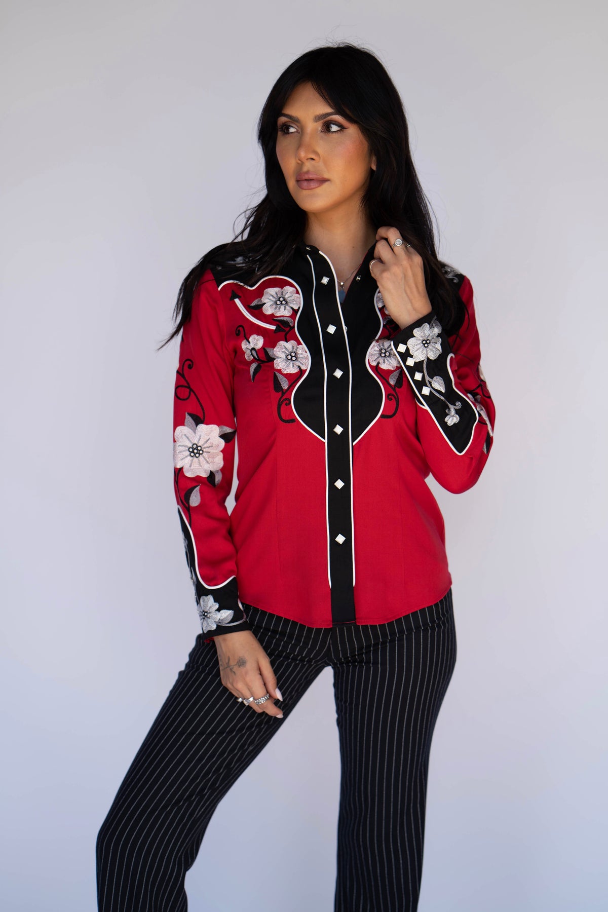 Full length view of the H Bar C Santa Ana women's red western shirt with black pinstripe trousers.