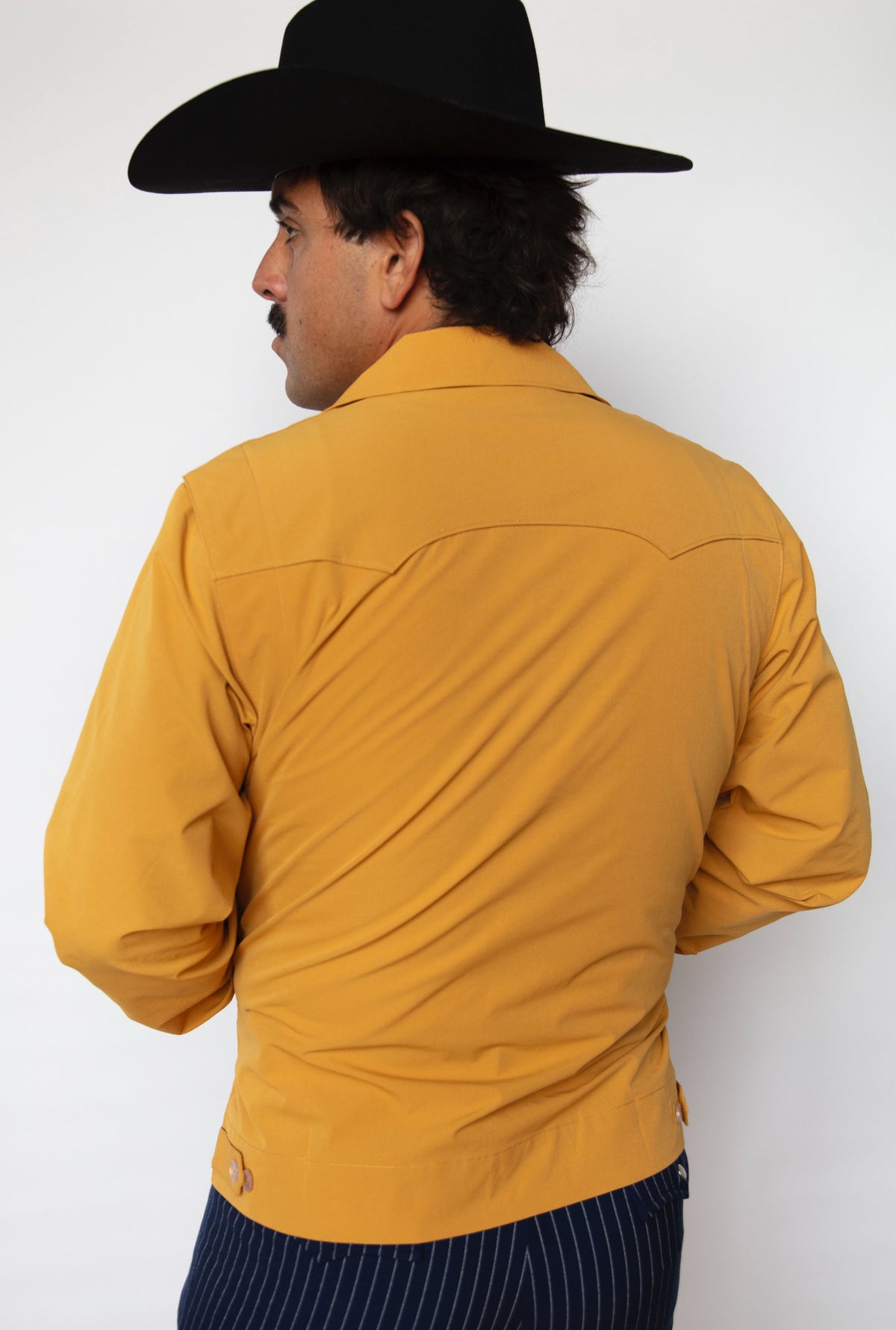 Back view of the H Bar C Mustang mustard jacket with western back yoke.