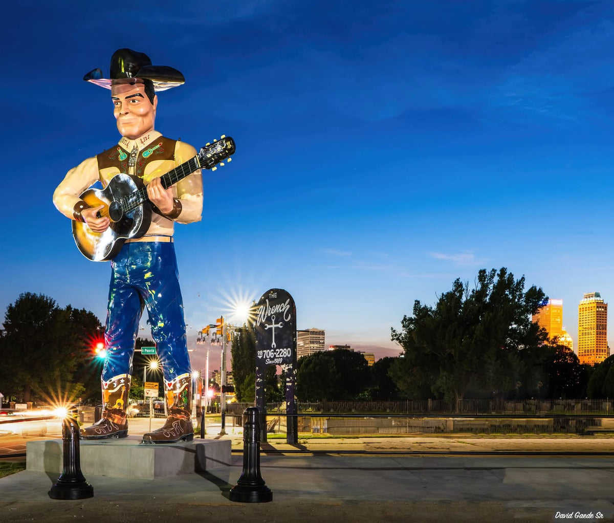Giant cowboy statue at dusk, the kind of mid-century western icon that inspired the H Bar C Cowboy Bob shirt.