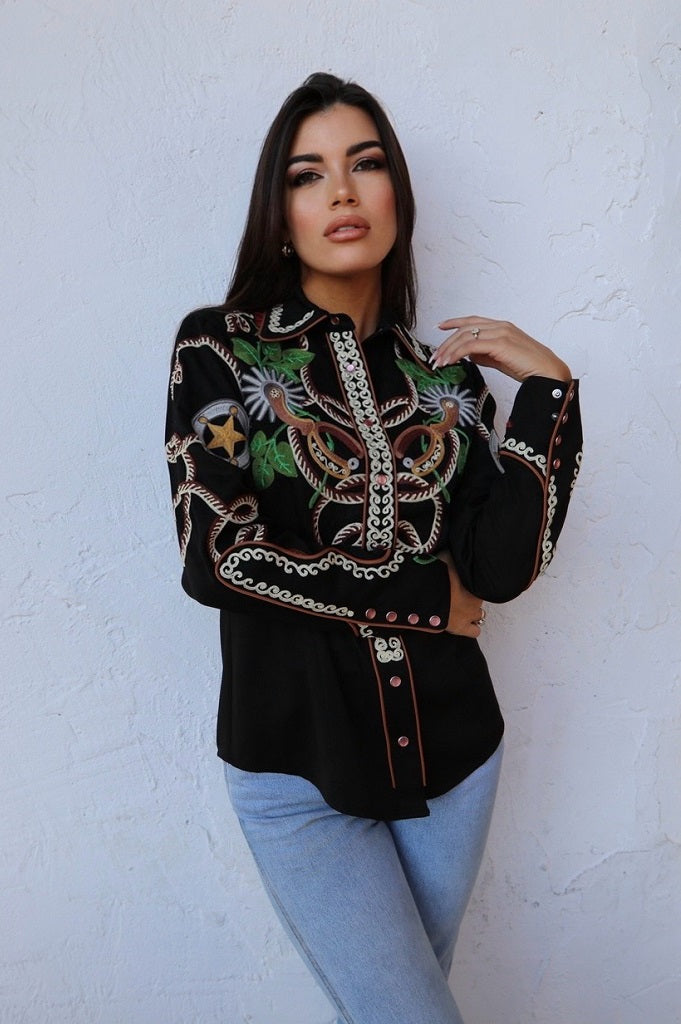 Model in the H Bar C Catalina black chain stitch western shirt tucked into jeans.