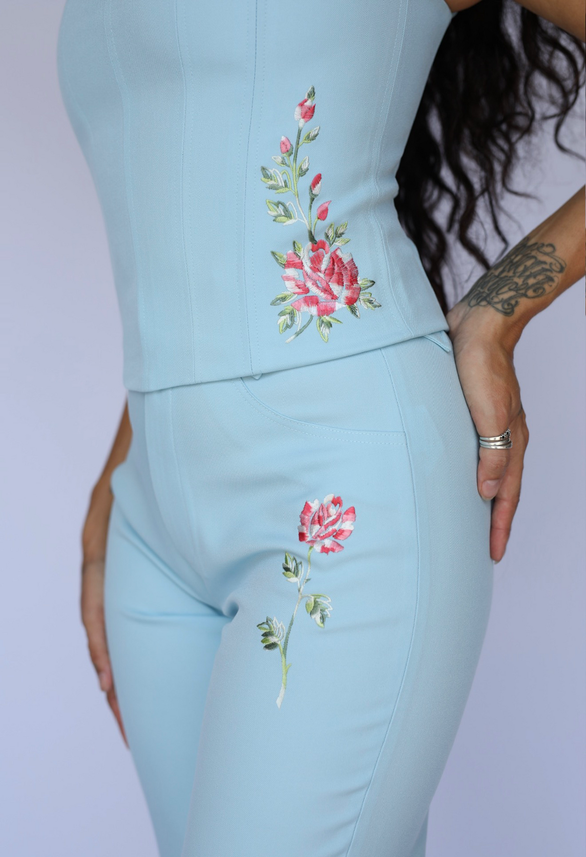 Close-up of the pink rose embroidery on the H Bar C Abilene light blue pants and matching corset.