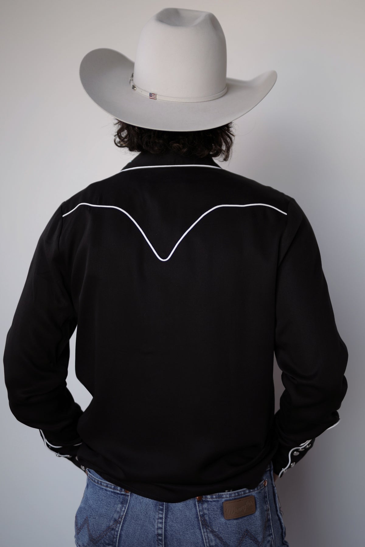Back view of the H Bar C Royal Flush black western shirt with piped back yoke.