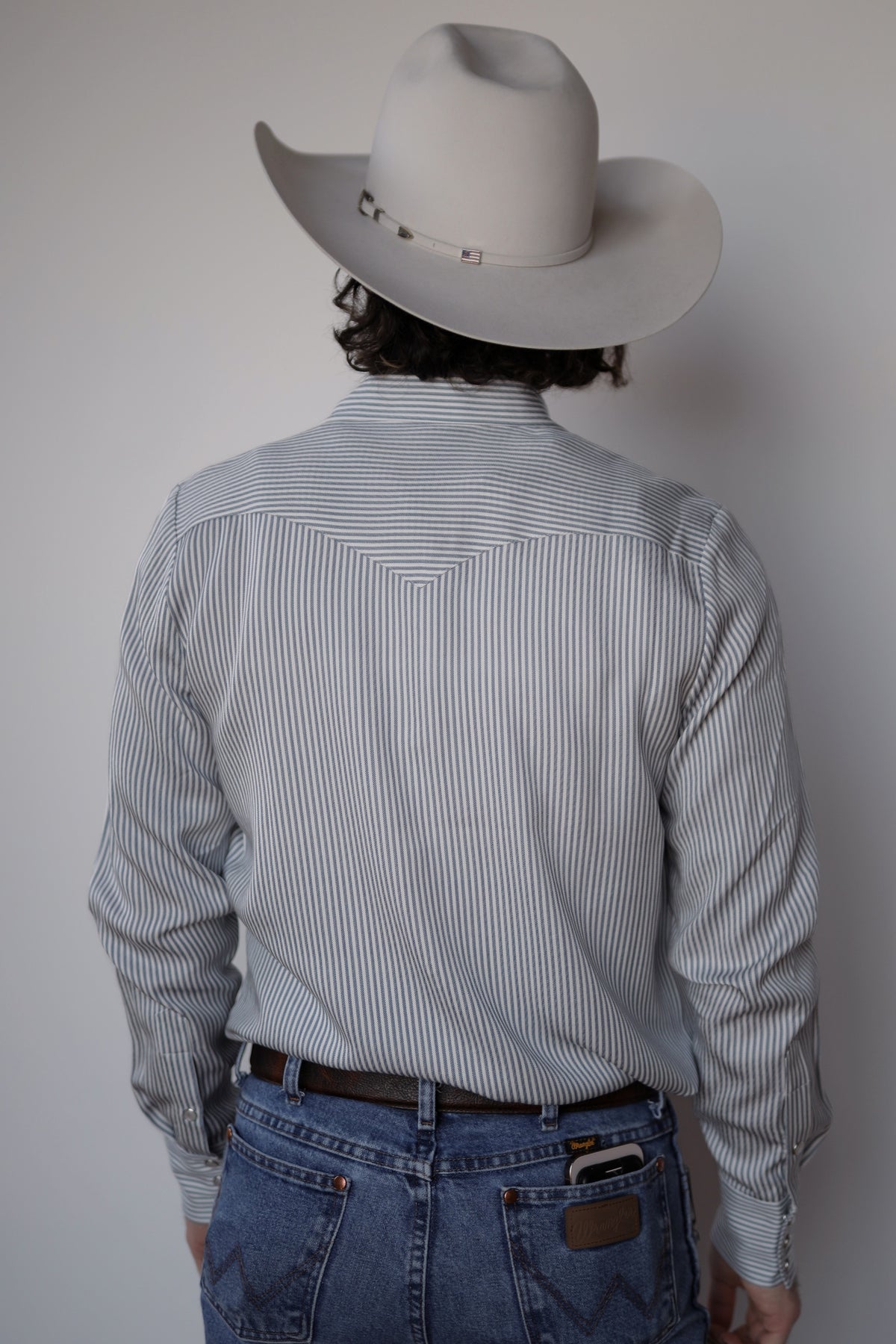 Back view of the H Bar C Folsom blue stripe western shirt with pointed back yoke.