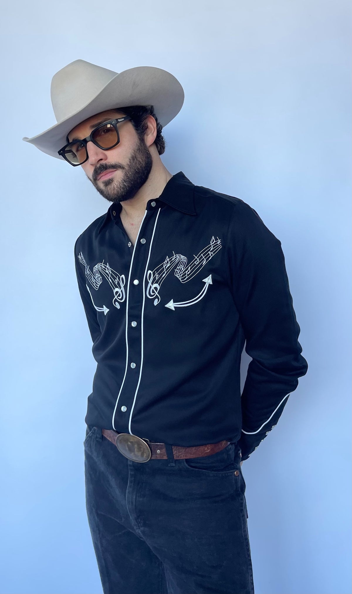 H Bar C Nashville black embroidered western shirt with jeans and a cream cowboy hat.