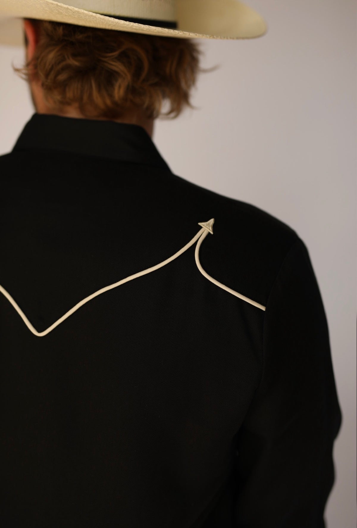 Close-up of the off-white piped back yoke with arrow tip on the H Bar C Reno black shirt.