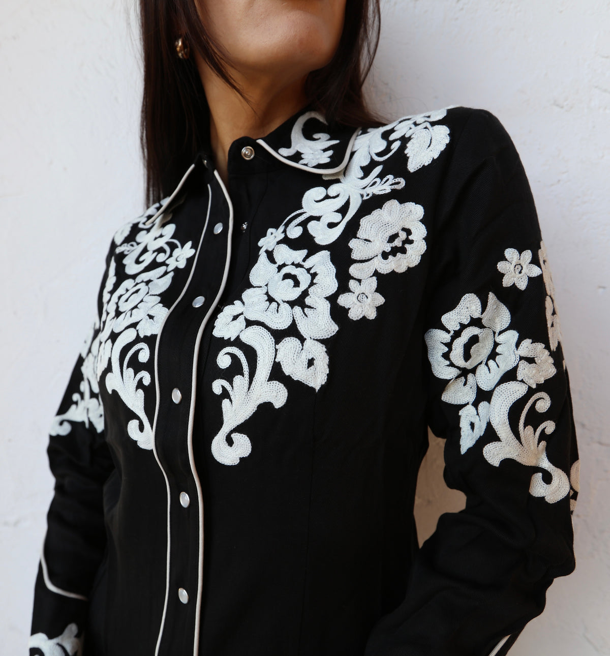 H Bar C Fort Worth women's black shirt with white floral chain stitch embroidery on the yokes and sleeves.