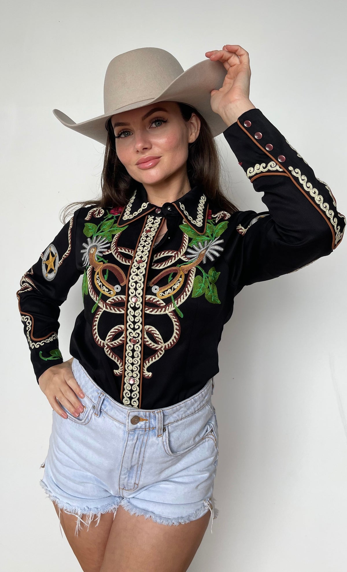 Front view of the H Bar C Catalina women's black shirt, our most chain stitched style, with lasso and floral embroidery.