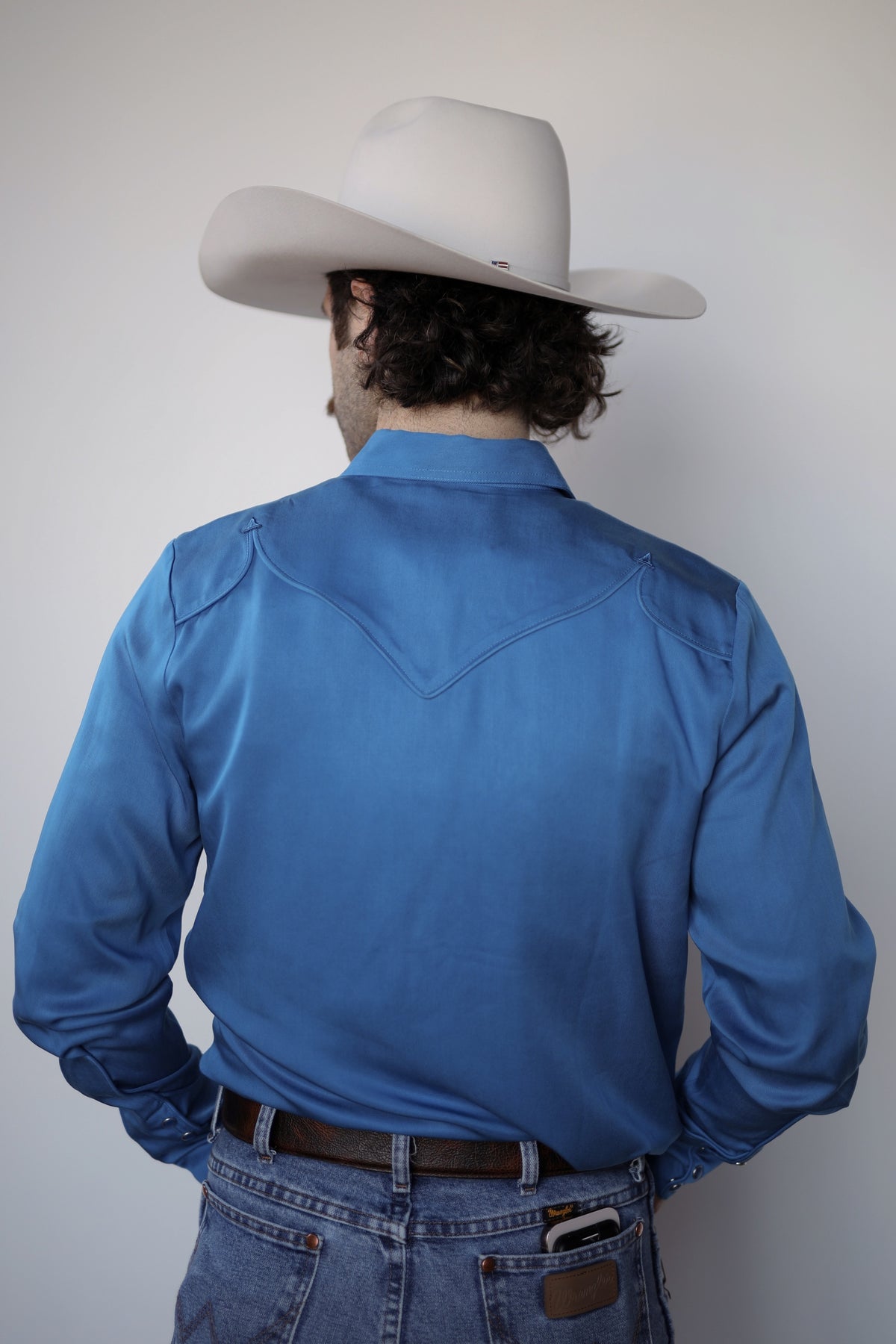 Back view of the H Bar C Reno royal blue western shirt with piped back yoke.