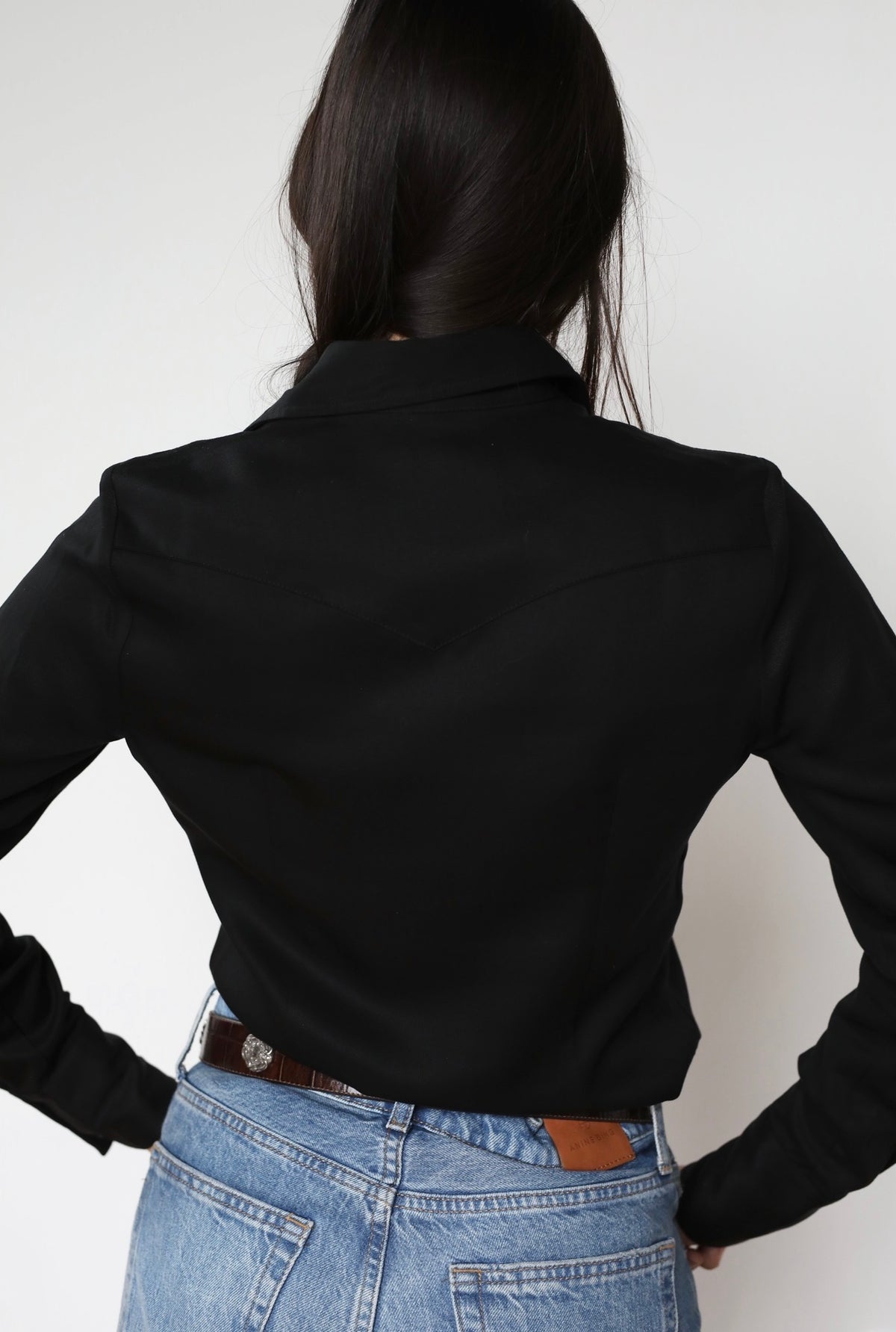Back view of the H Bar C Denver women's black western shirt with pointed back yoke.