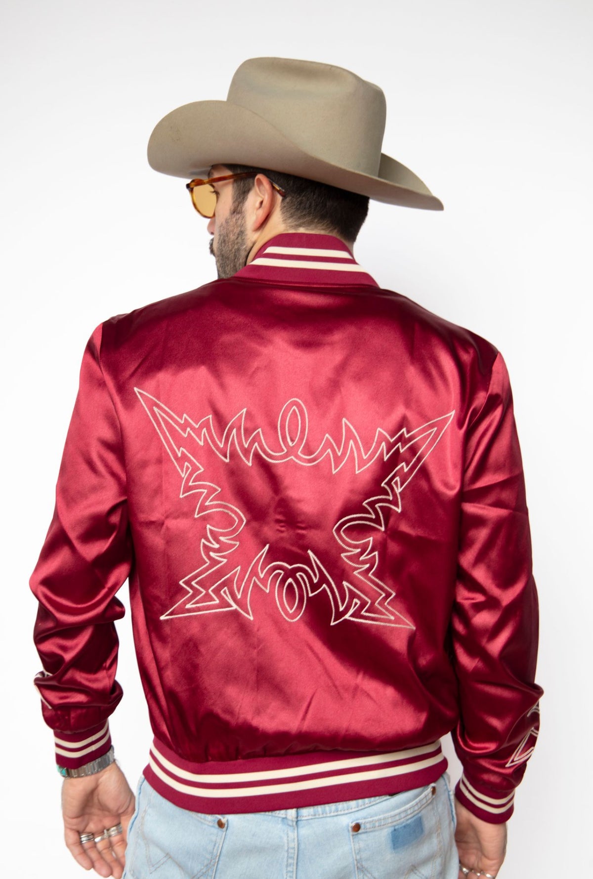 Back view of the H Bar C Odessa red tour jacket with white embroidered back.