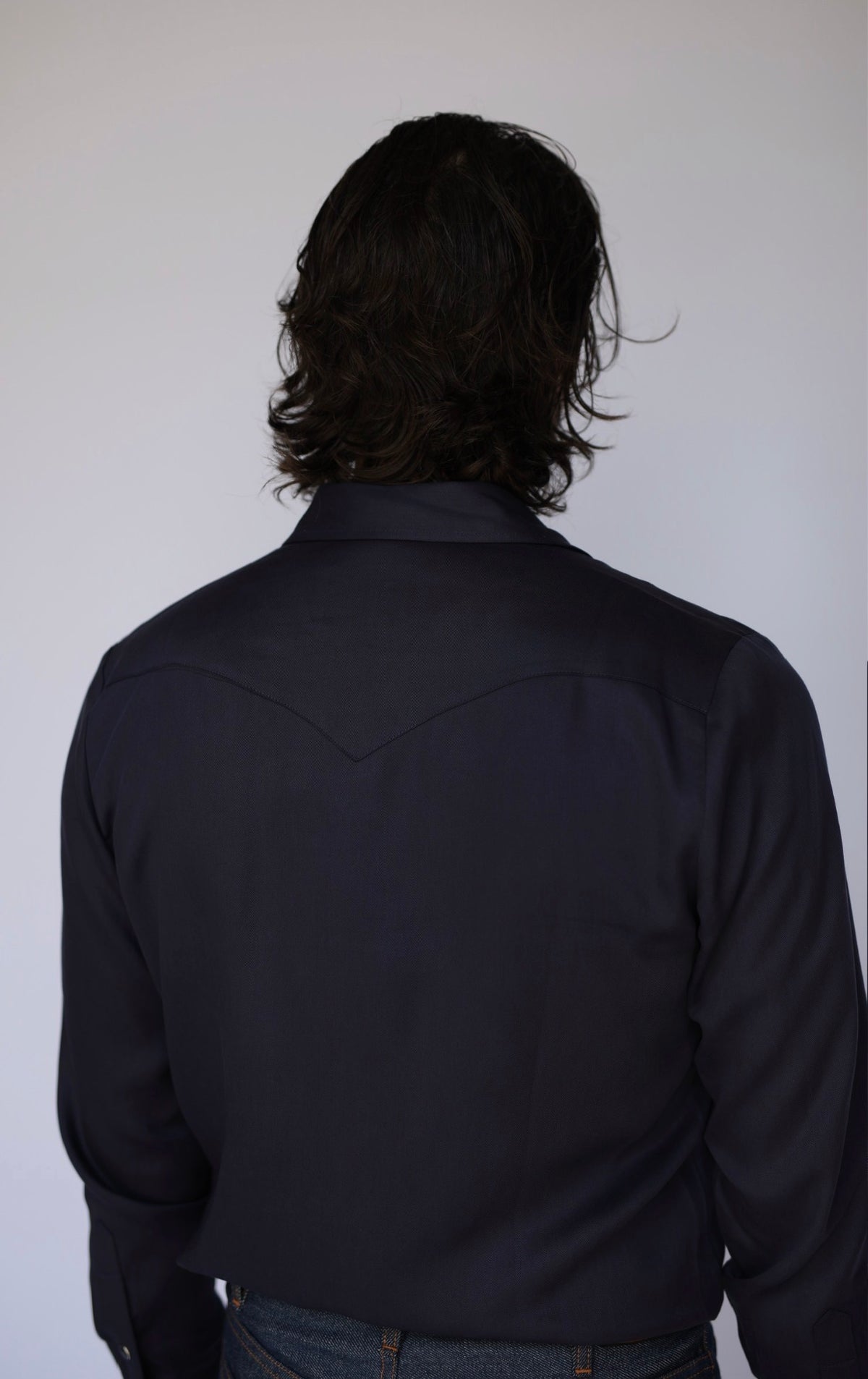 Back view of the H Bar C Denver men's navy western shirt with pointed back yoke.