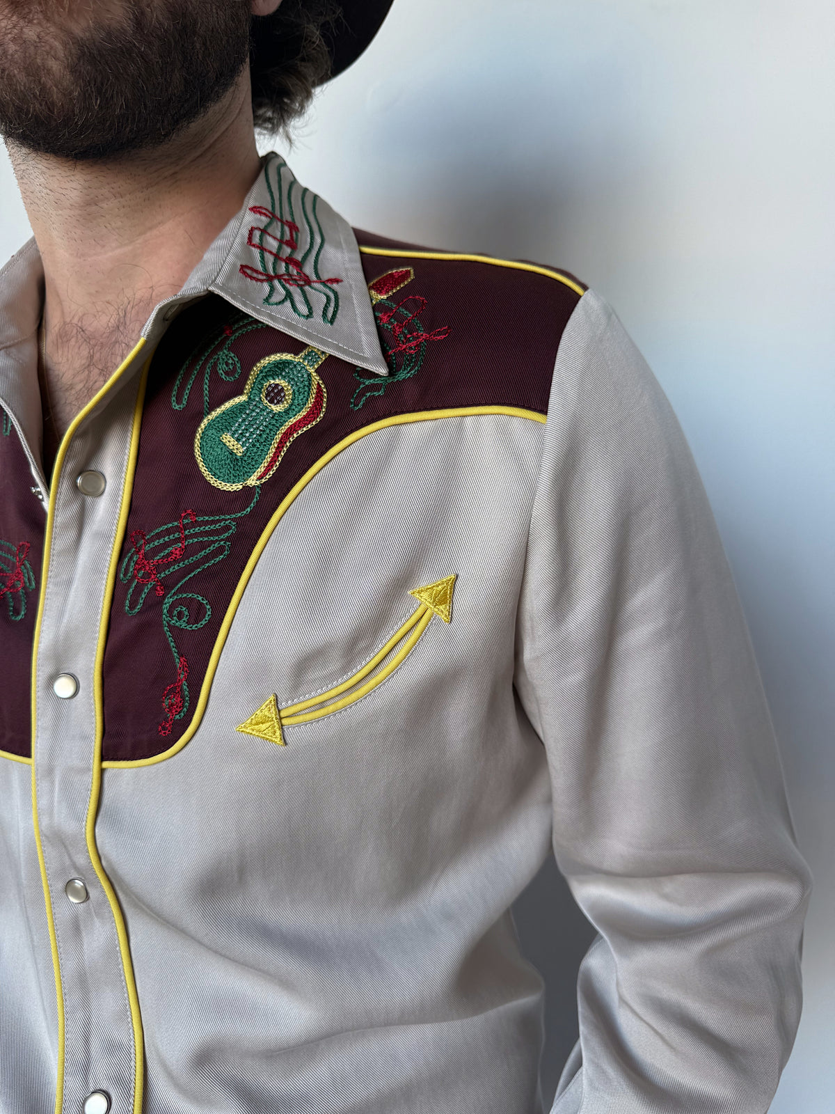 Front yoke close-up showing green chain stitch embroidery on the H Bar C Cowboy Bob shirt.