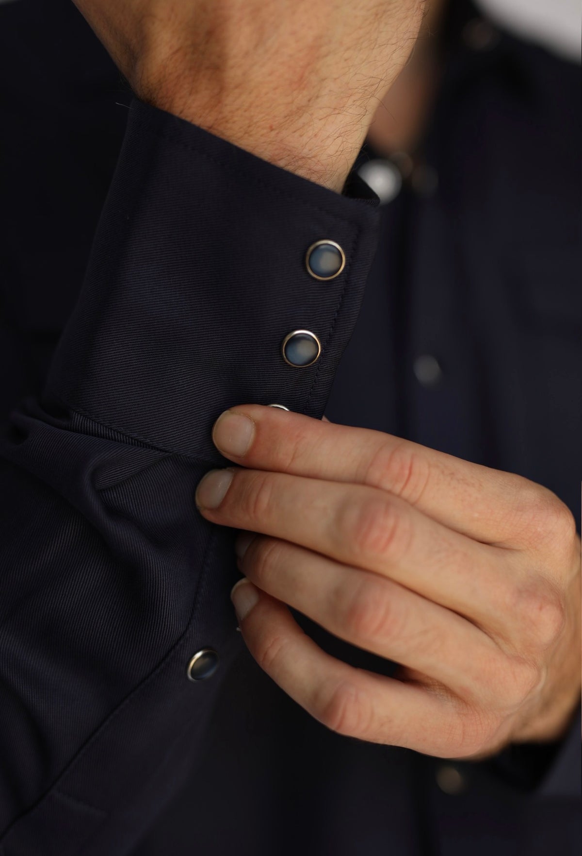 Collar and snap detail of the H Bar C Denver men's navy western shirt.
