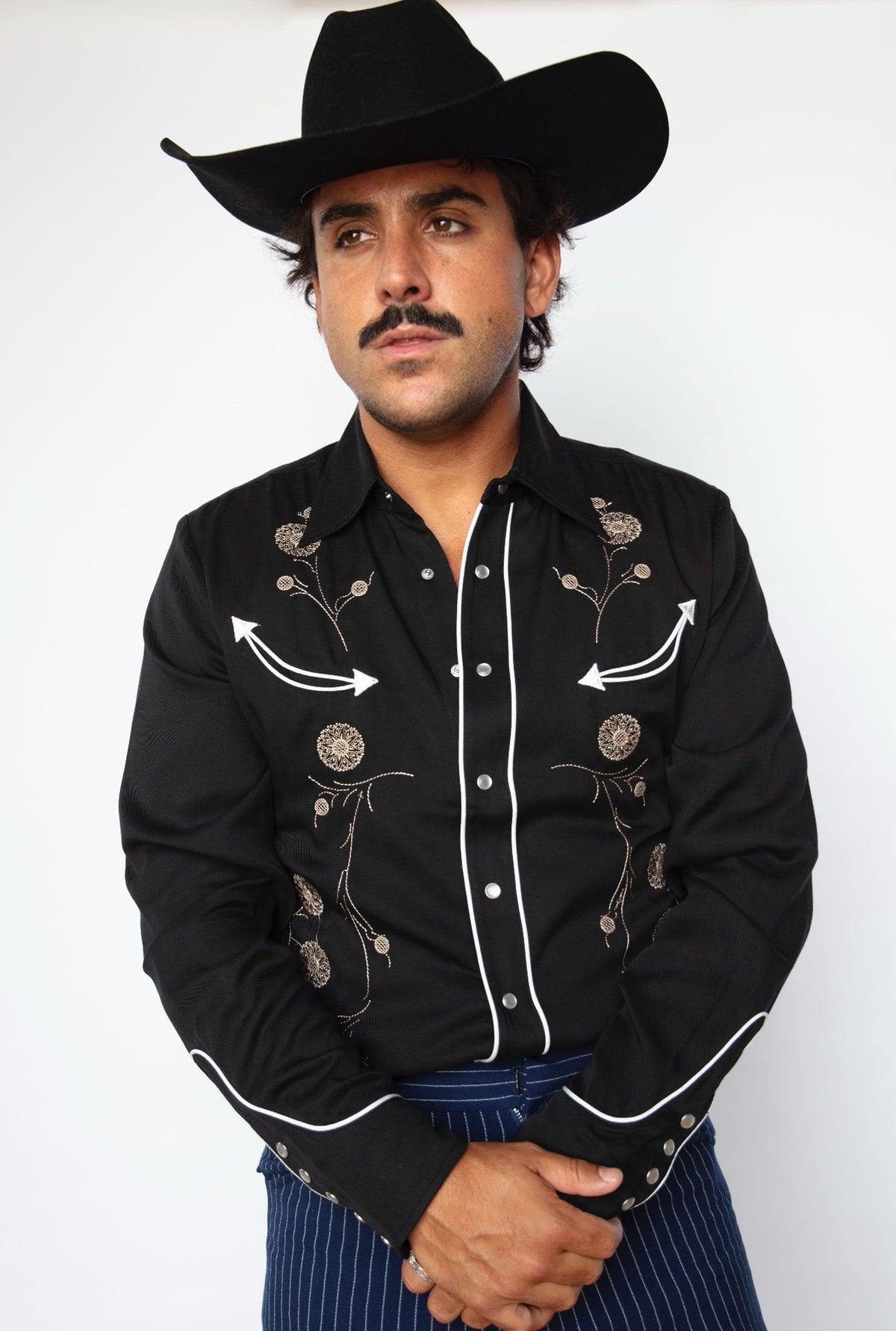Front view of the HBarC x Gibson J-200 men's black western shirt, the San Fernando with J-200 guitar inspired embroidery.