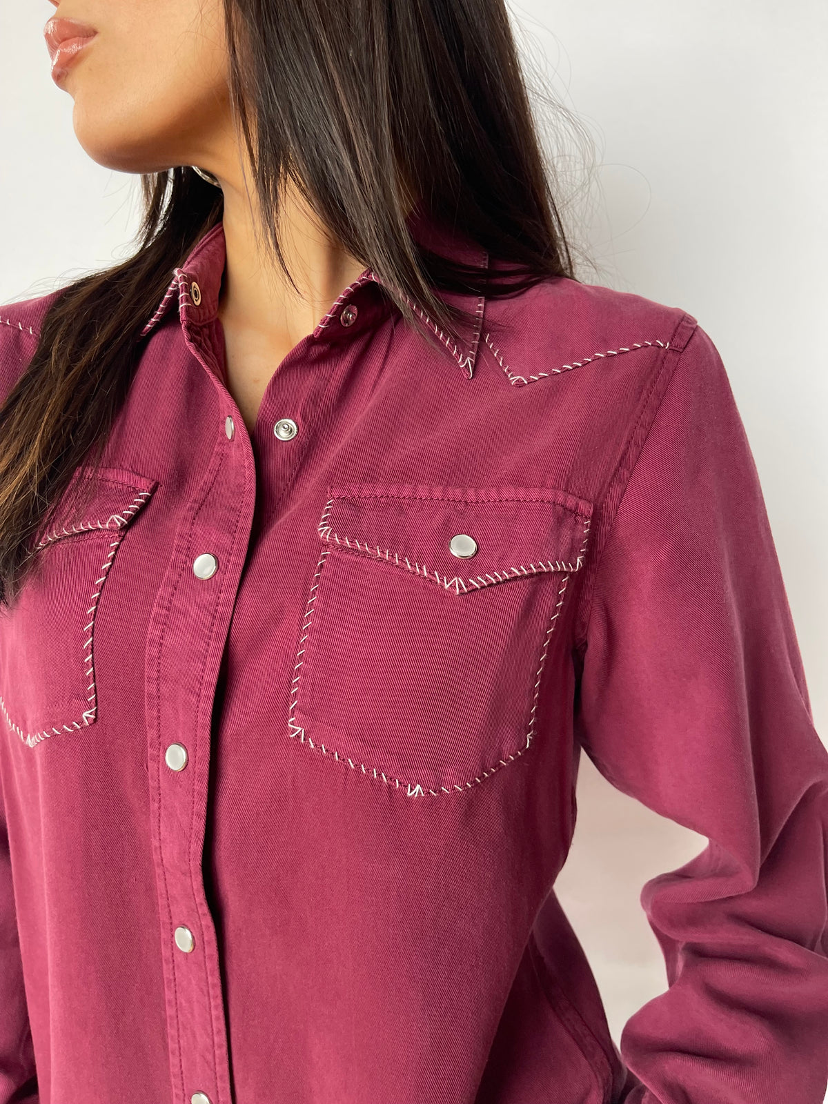 Close-up of the stitched pocket and snaps on the H Bar C Brooklyn women's wine shirt.