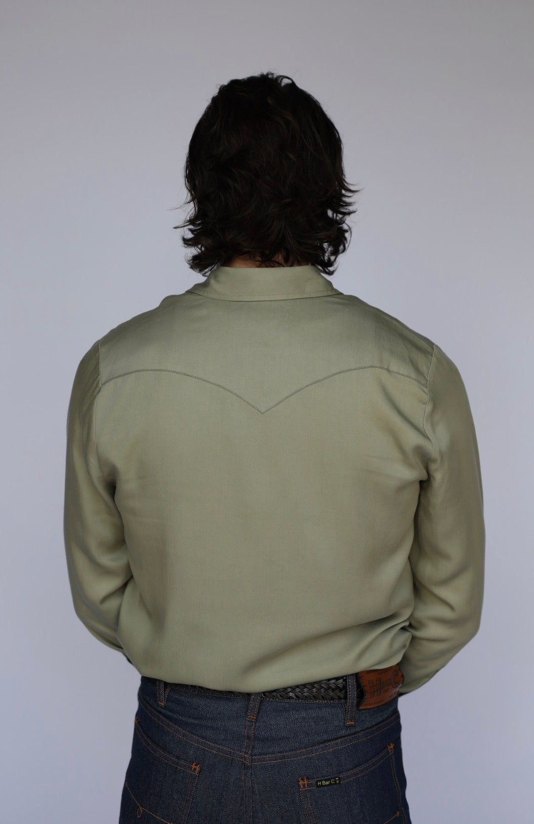 Back view of the H Bar C Denver men's green western shirt with pointed back yoke.