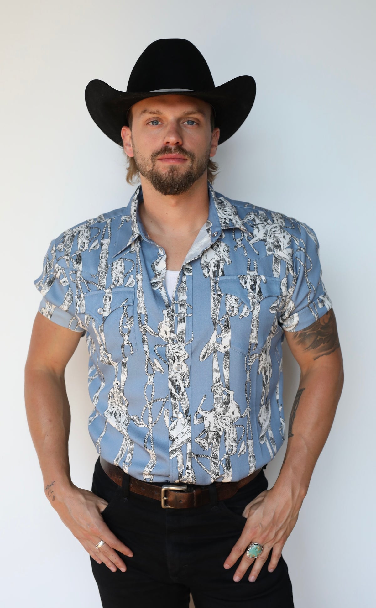 H Bar C Newport Breckenridge light blue print western shirt tucked into black jeans.