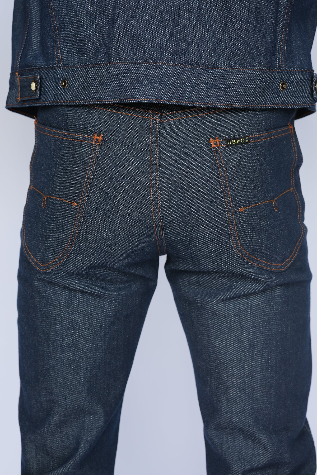 Rear view of the H Bar C Salina indigo jeans worn with the Salina trucker jacket.