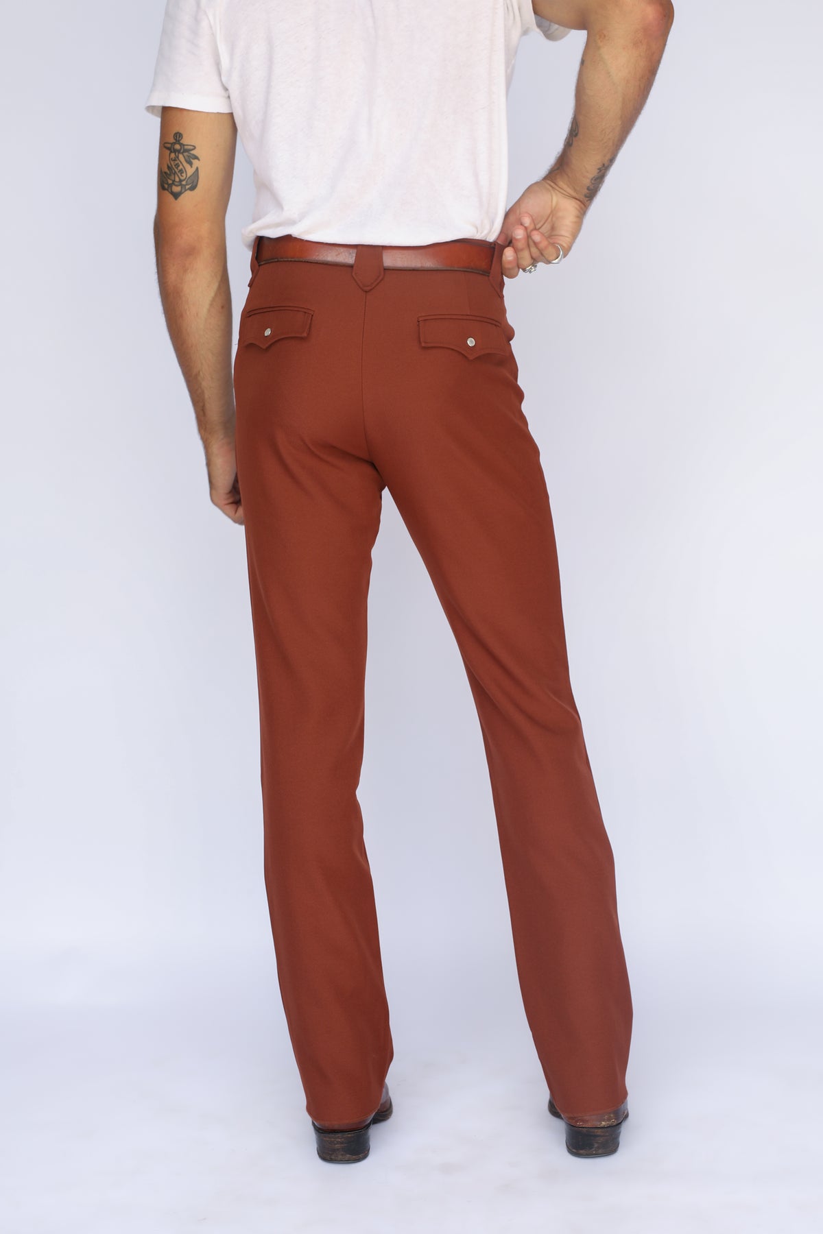 Rear view of the H Bar C Franklin brown stretch western pants from the waist down.