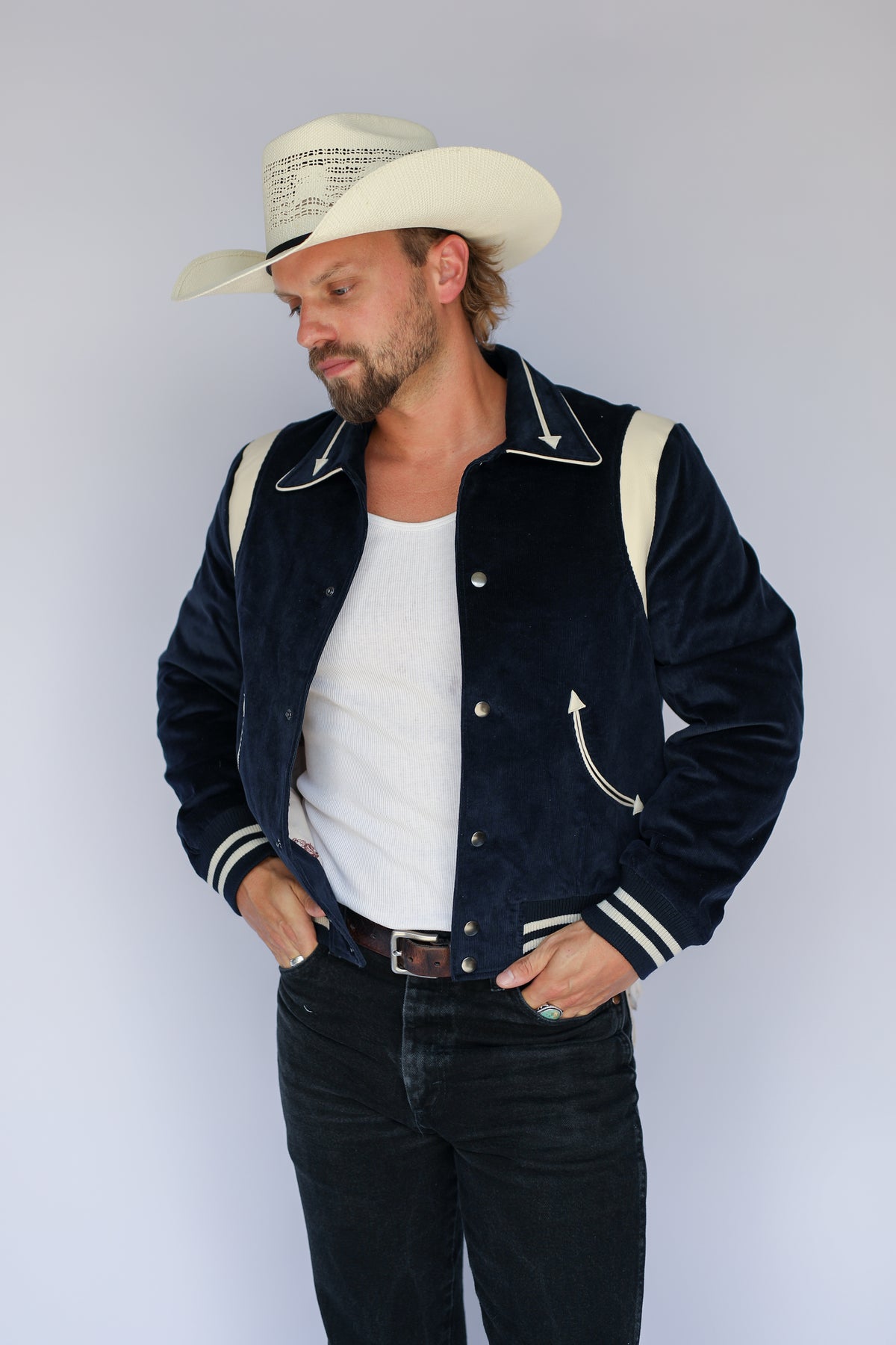 Front view of the H Bar C Silver Lake navy corduroy jacket with striped ribbing and arrow pockets.