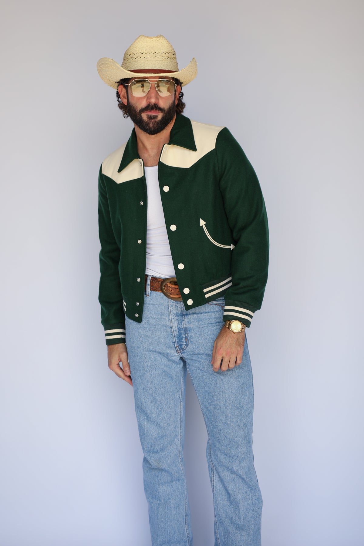 Full length view of The Vail green jacket by H Bar C with light jeans and a cowboy hat.