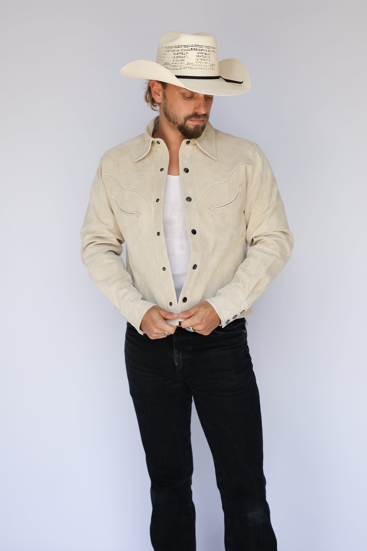 Full front view of the H Bar C Austin stone suede jacket with black jeans and cowboy hat.