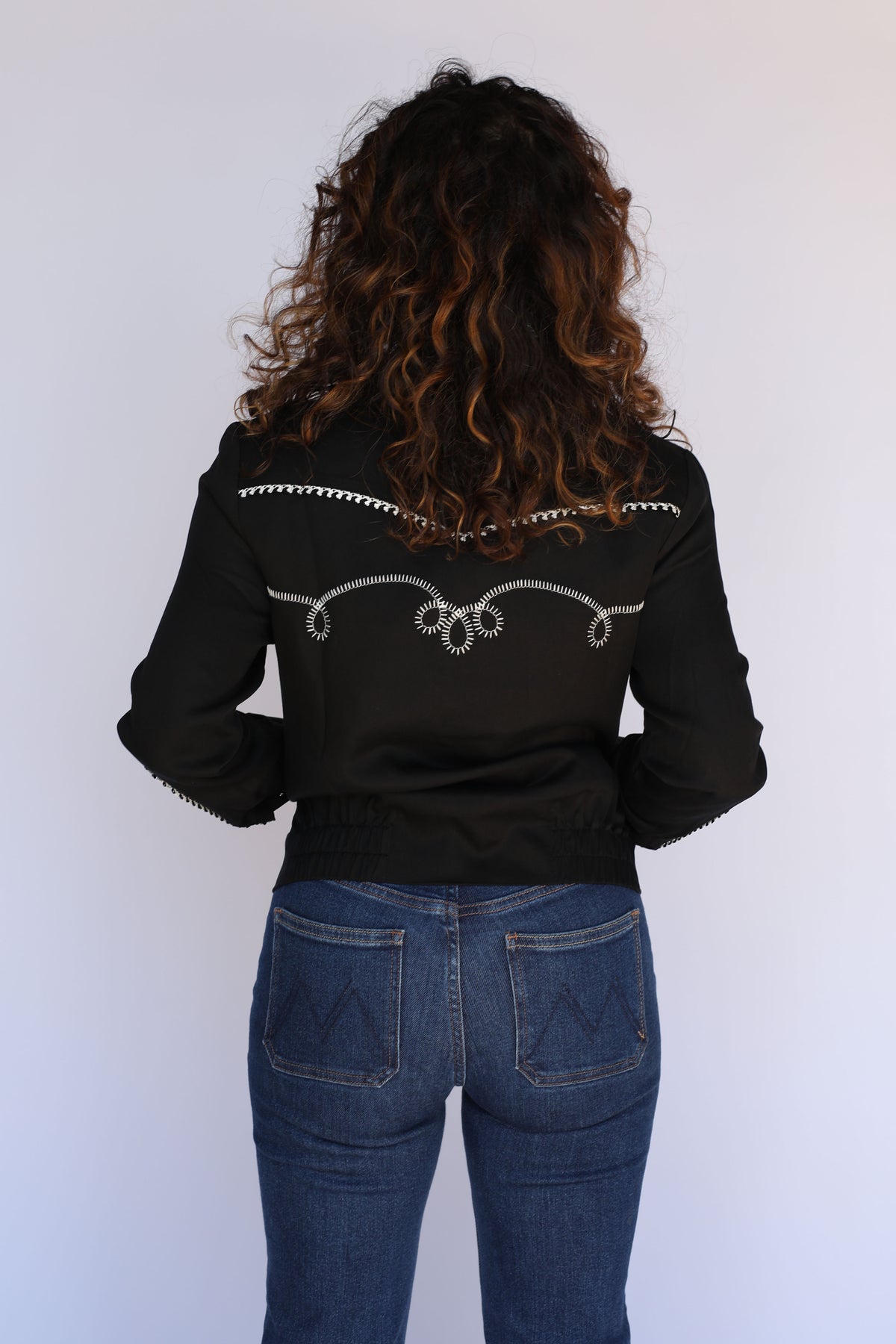 Back view of the H Bar C Bolero women's black and white cropped western jacket.