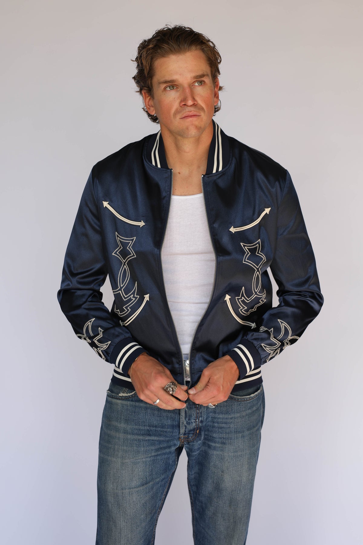 H Bar C Odessa navy satin jacket styled open, vintage inspired western wear with cream boot stitch embroidery on the front panels.