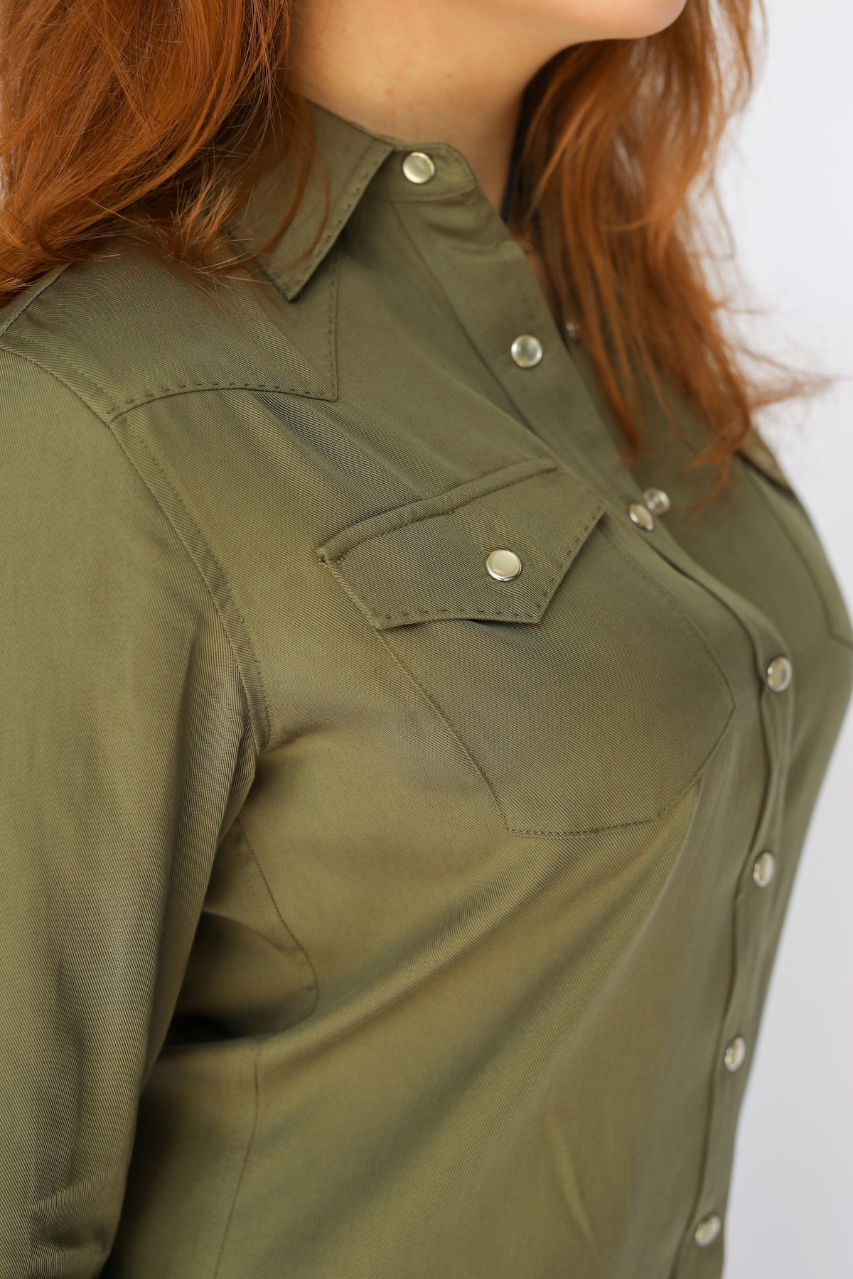 Close-up of the pocket and snap front on the H Bar C Savannah green western dress.