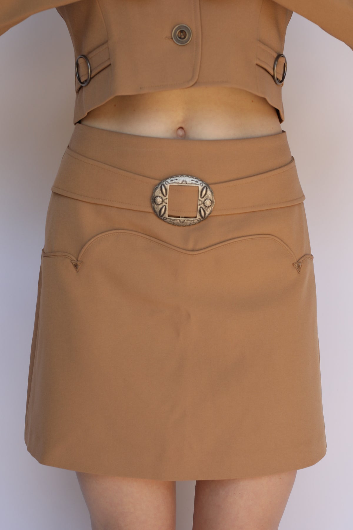 Detail of the H Bar C Raleigh tan skirt waistband belt with engraved concho buckle, vintage western wear.