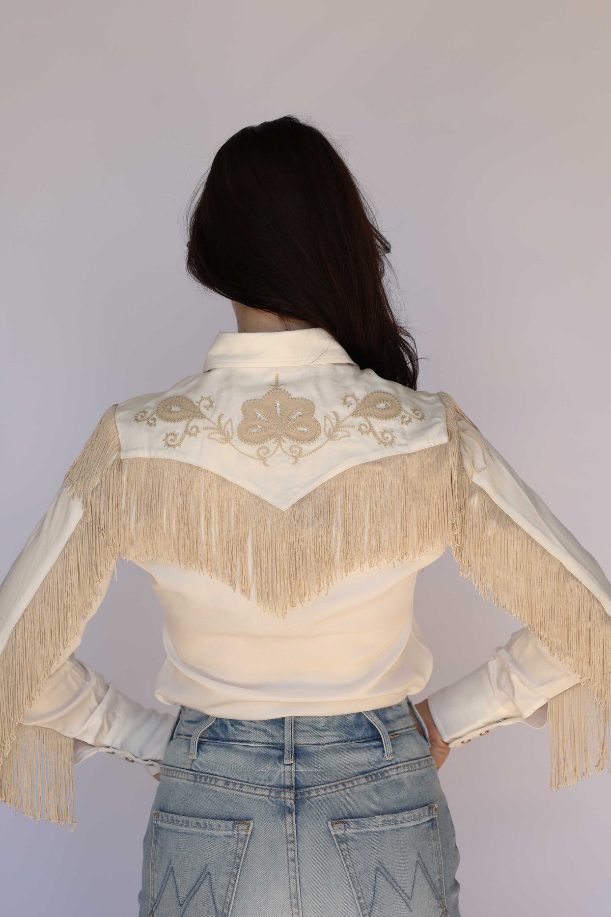 Back view of the H Bar C Taos women's white shirt with fringe across the back yoke, vintage inspired western wear.
