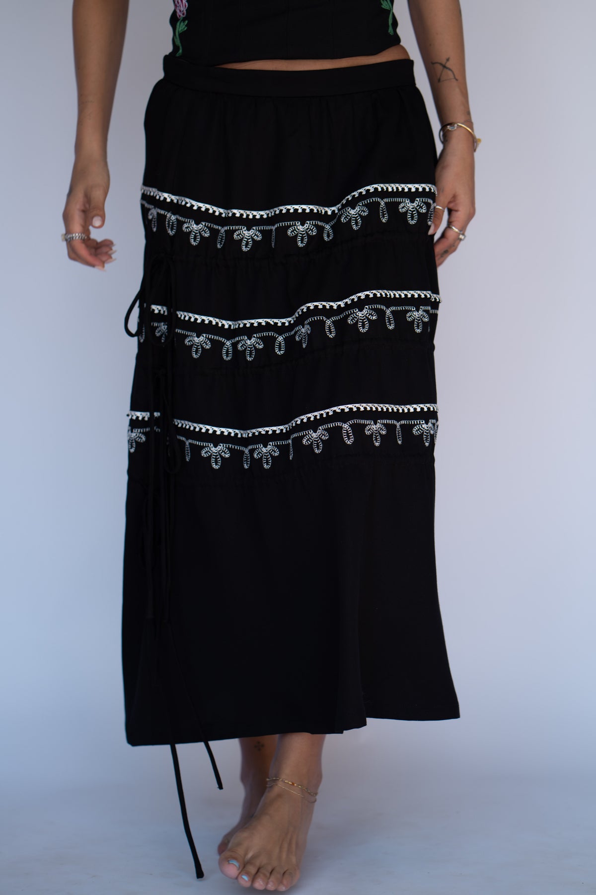 H Bar C Coachella black tiered maxi skirt with white embroidered bands inspired by the Bolero jacket.