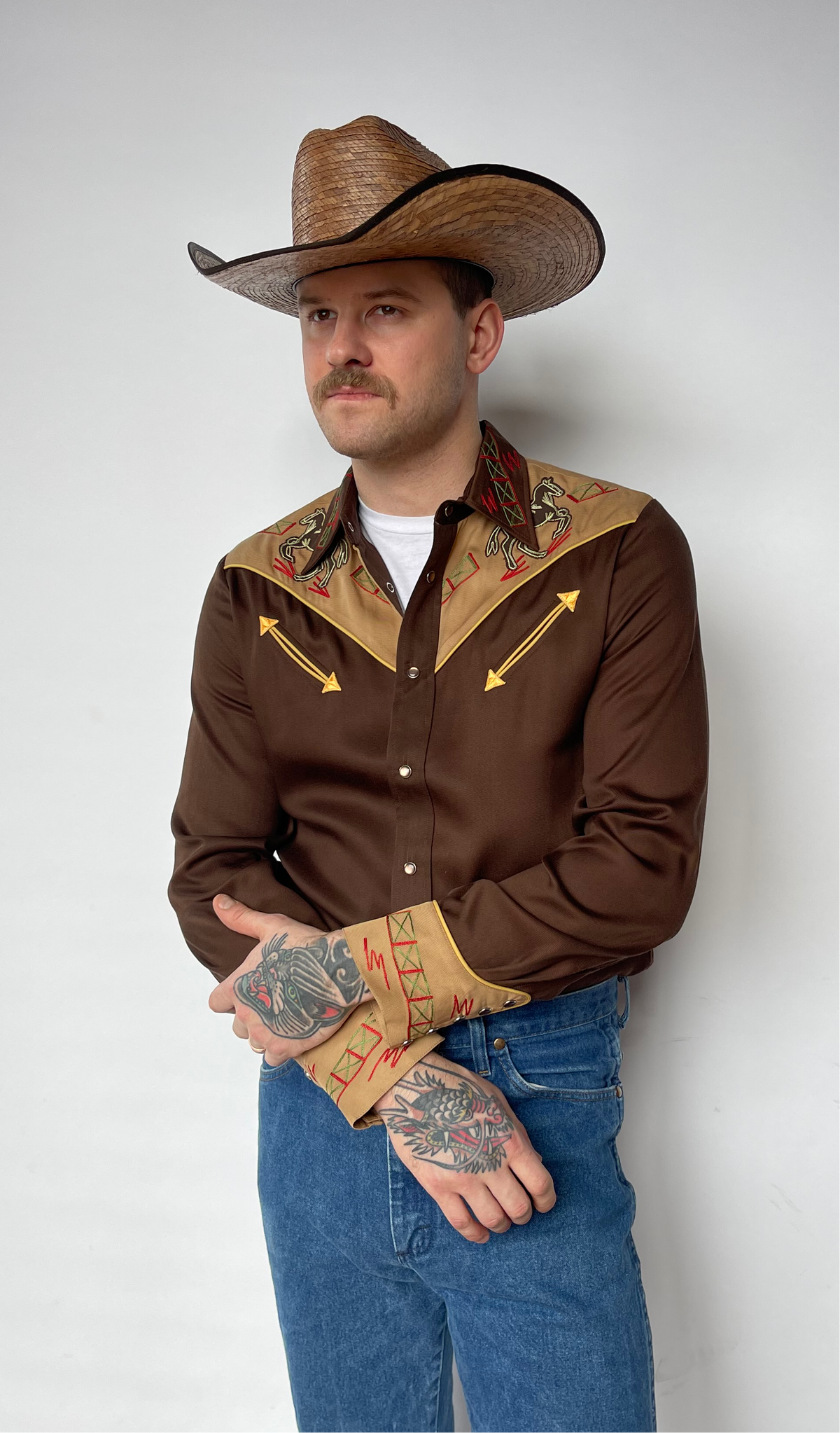 Front view of the H Bar C Bozeman brown and tan two-tone western shirt with jeans.