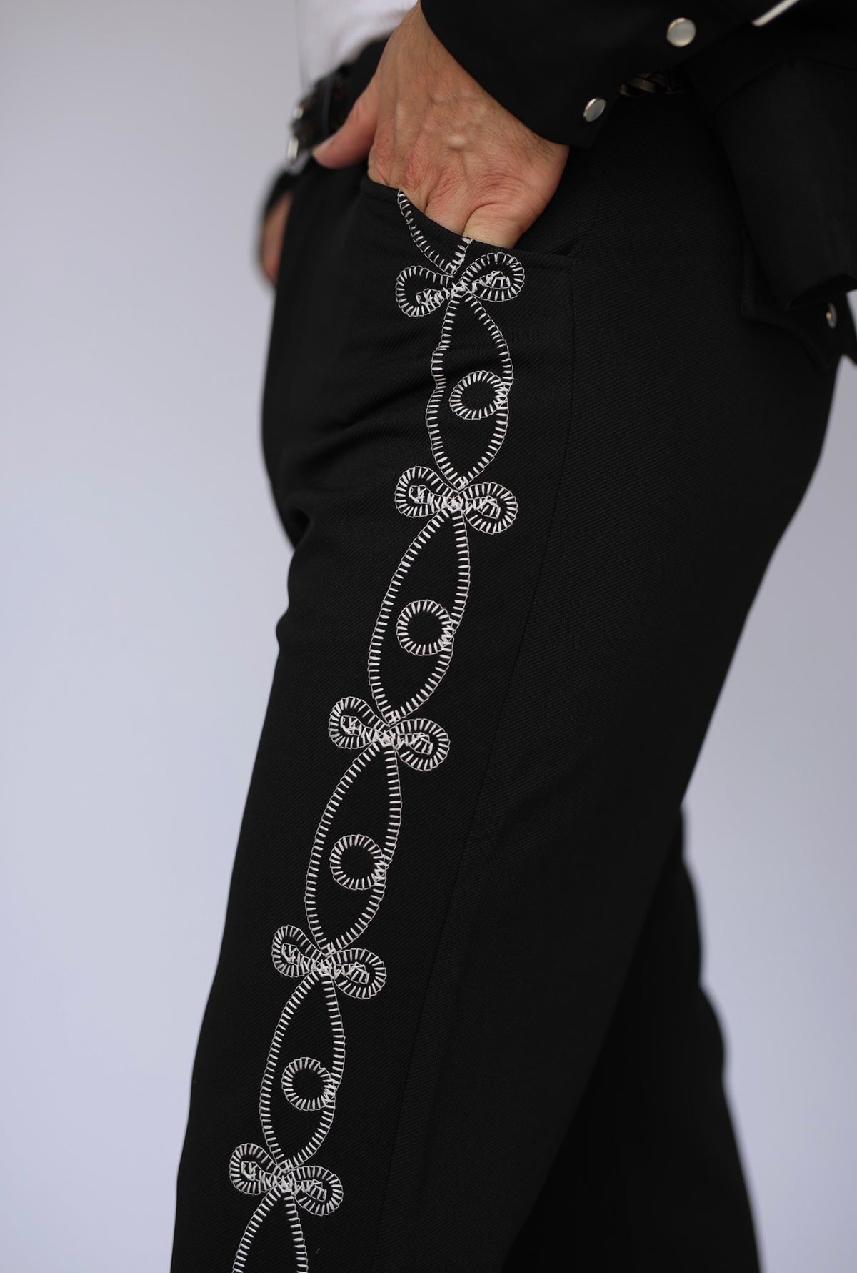 Side leg detail of the H Bar C Bolero El Patrón black straight-leg western trousers.