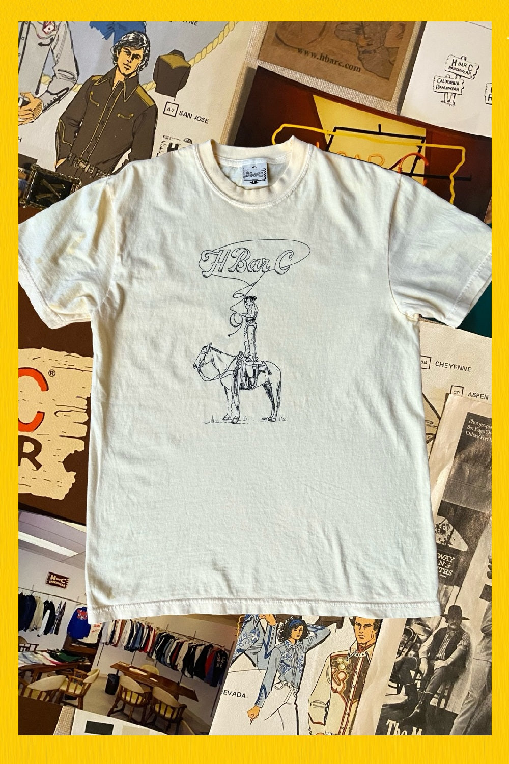 H Bar C Tall Saddle tee laid on a collage of vintage western photographs.