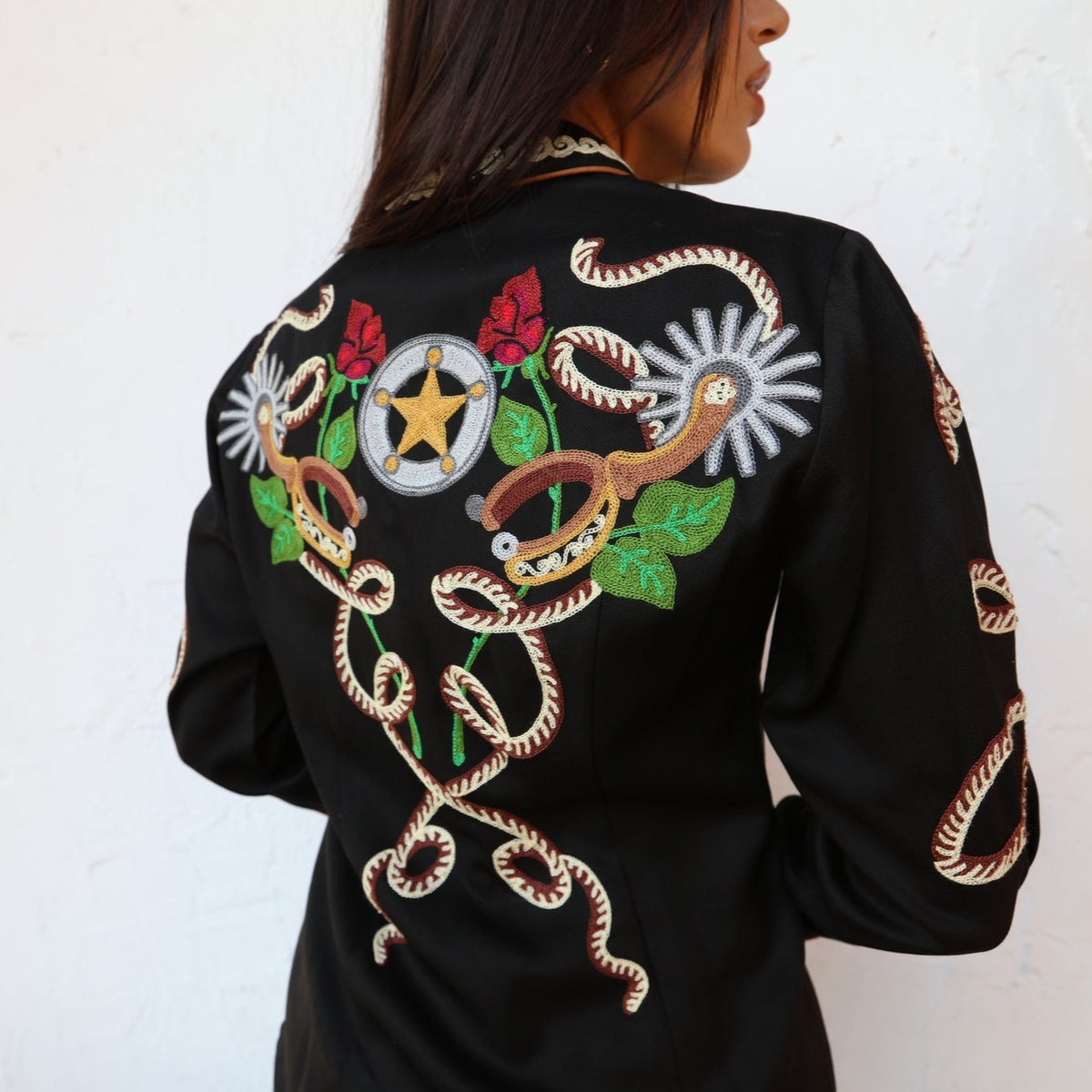 Back of the H Bar C Catalina black shirt with chain stitched rope, roses, and western motifs.
