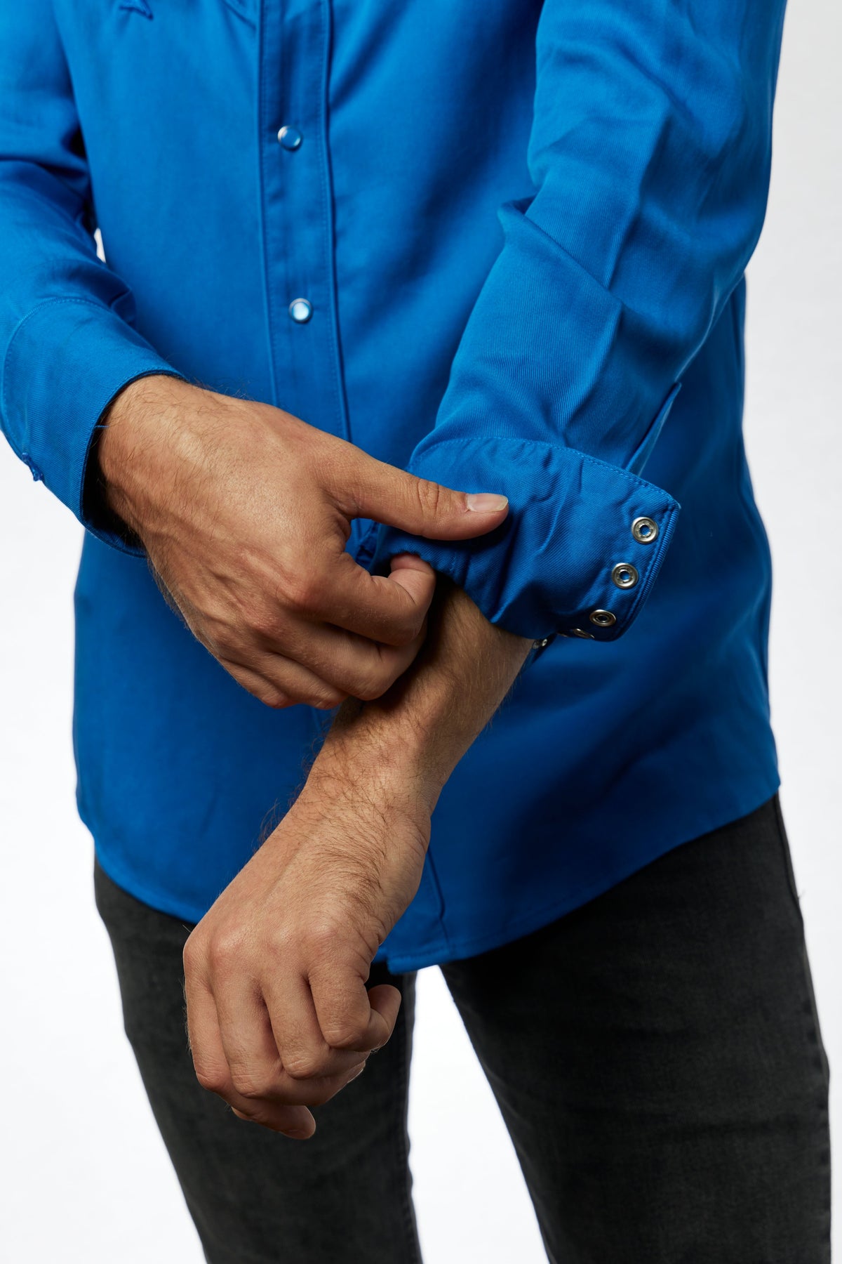 Close-up of the snap cuff on the H Bar C Reno royal blue shirt.