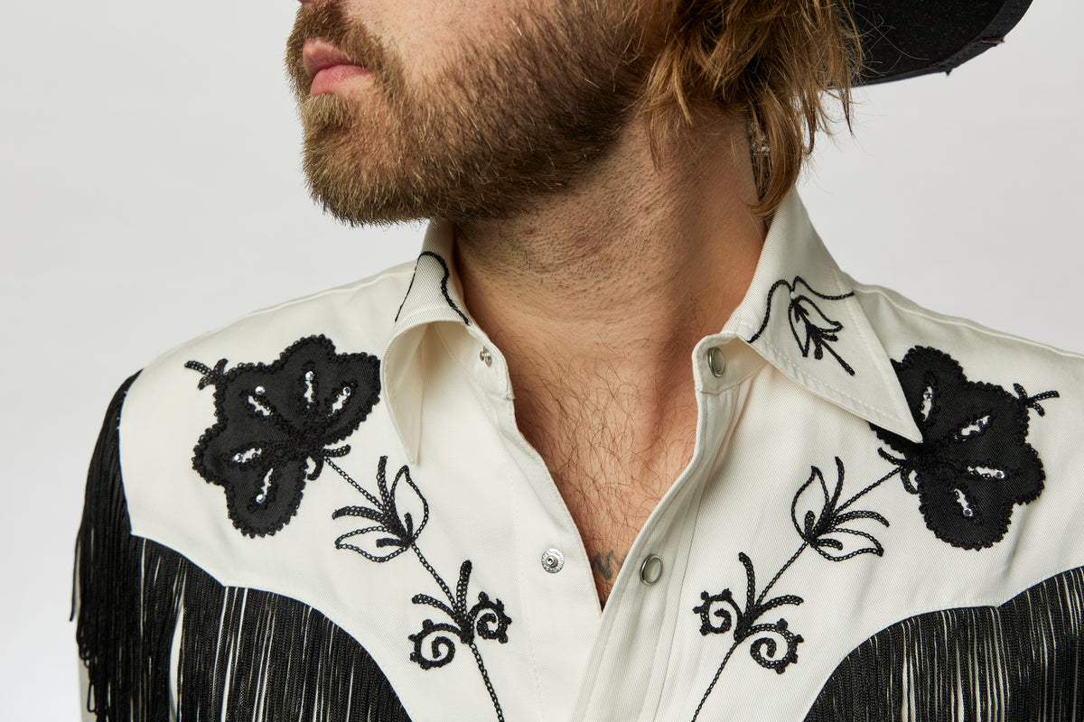 Collar and yoke close-up of the black floral embroidery on the H Bar C Taos white shirt.