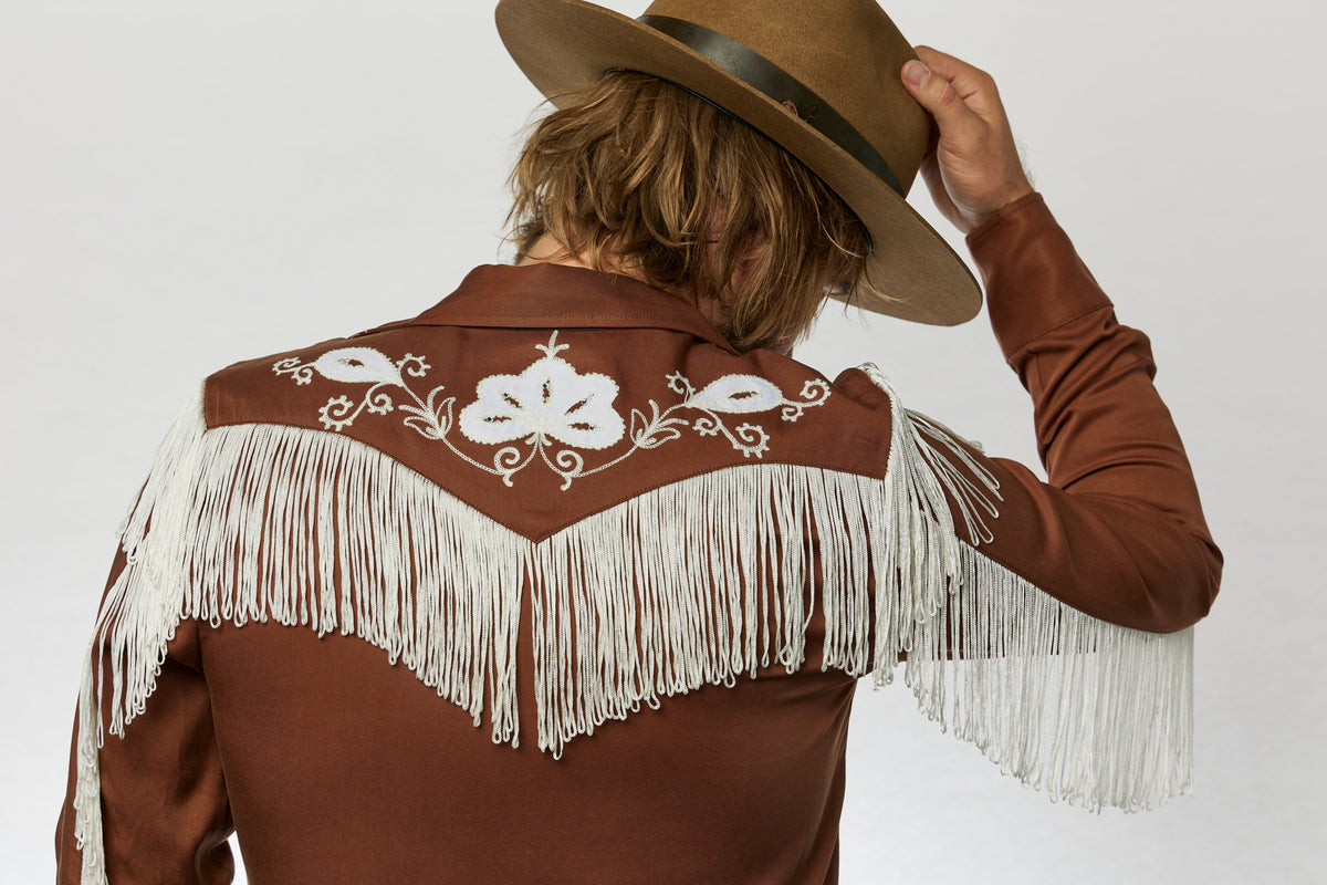 Back view of the H Bar C Taos men's brown shirt with white fringe across the yoke.