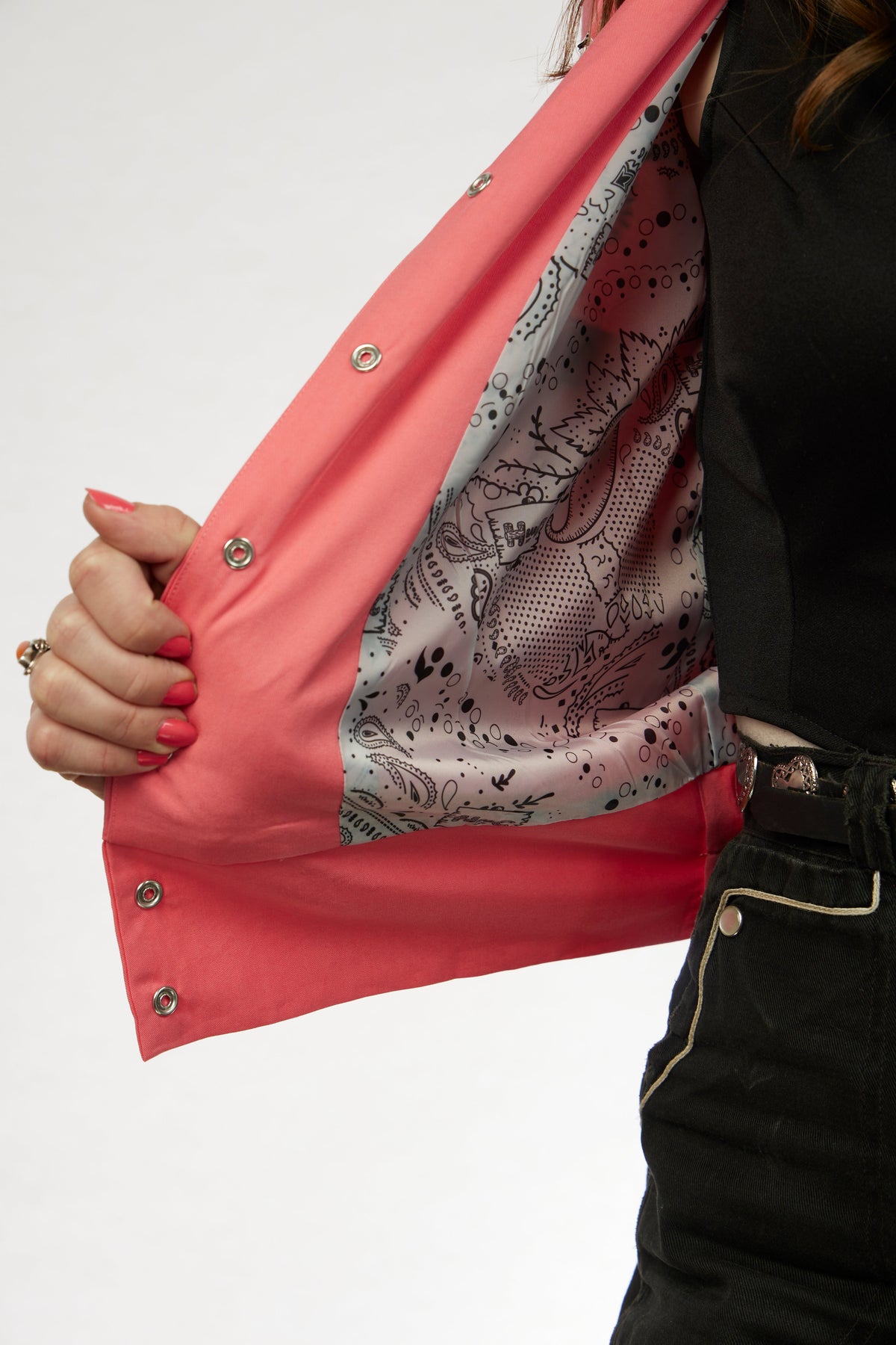 Inside view showing the paisley lining of the H Bar C Bolero women's pink jacket.