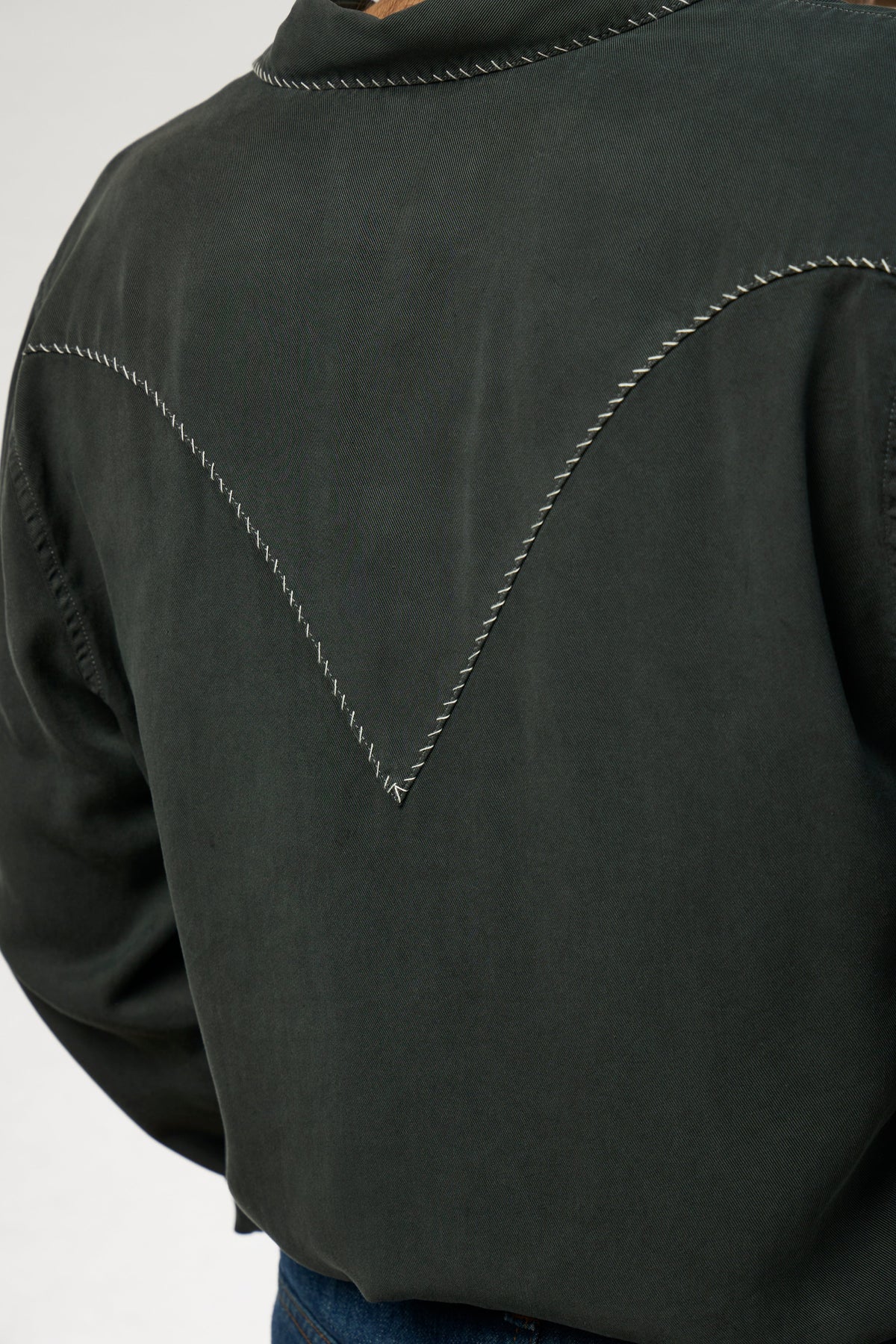 Back yoke of the H Bar C Brooklyn men's black western shirt with white accent stitching.