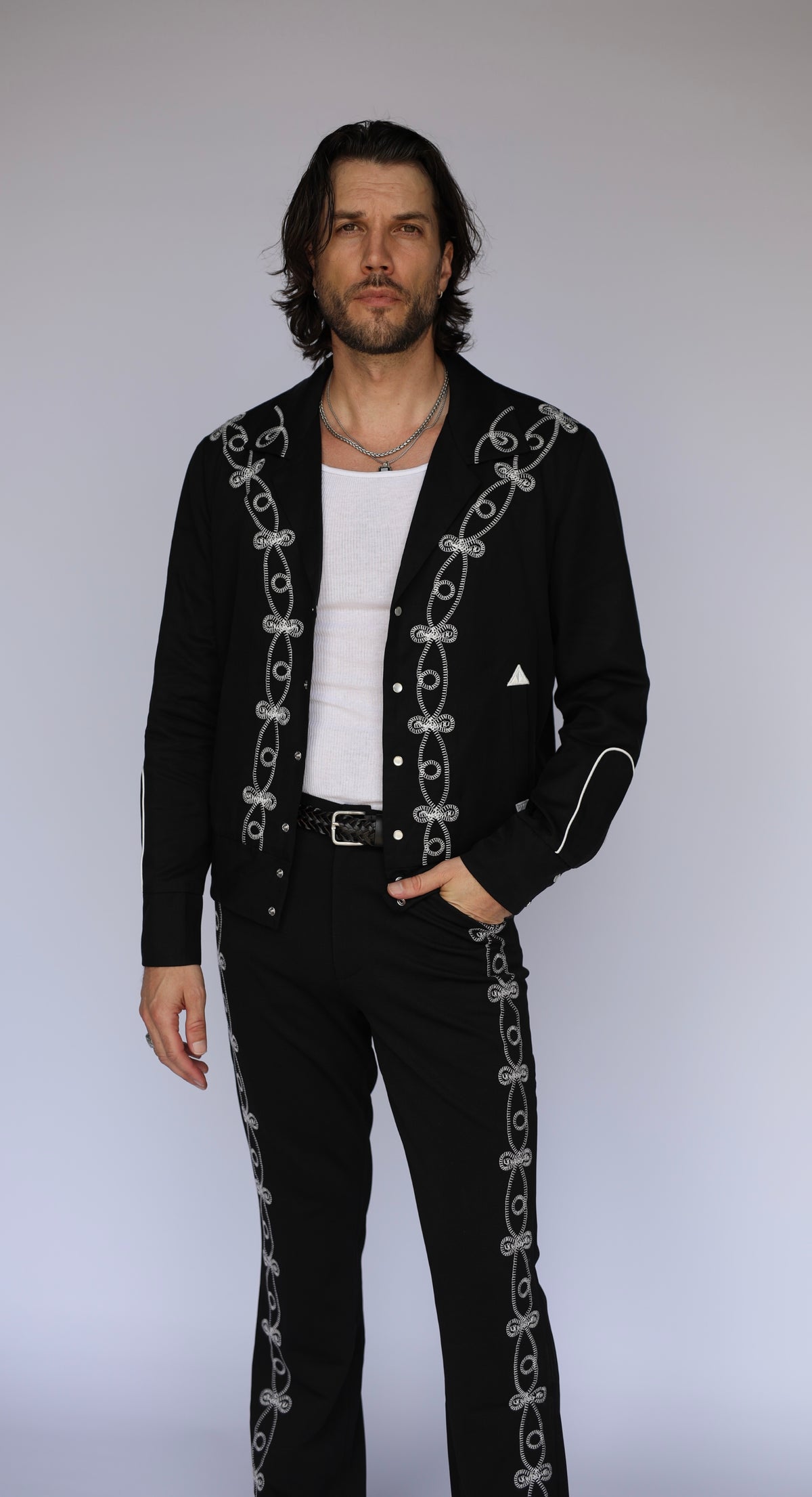 Man wearing the H Bar C Bolero El Patrón black jacket and matching soutache braided pants.