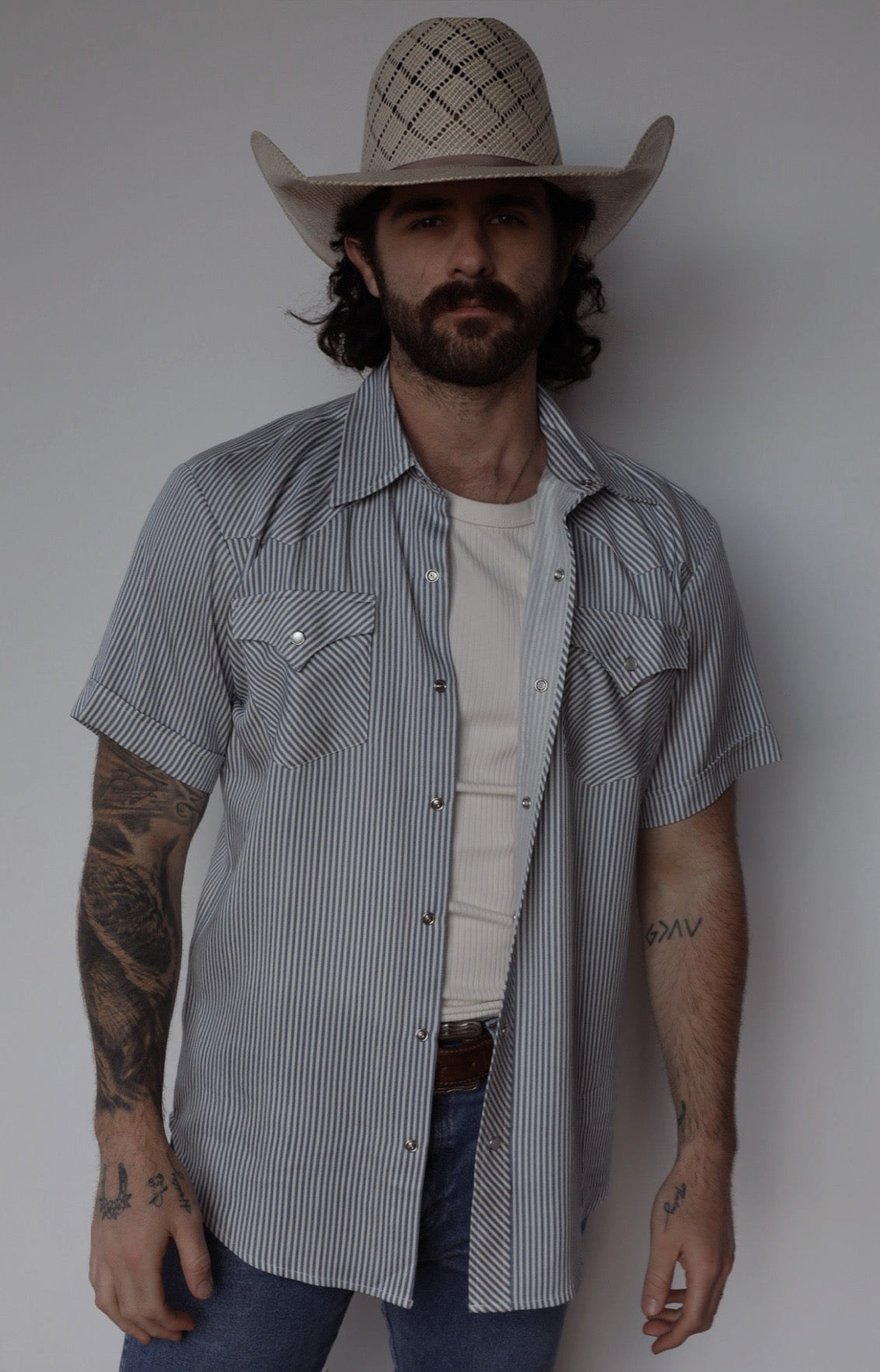 Three-quarter view of the H Bar C Newport short sleeve western shirt in gray stripe, a summer version of the classic Denver.
